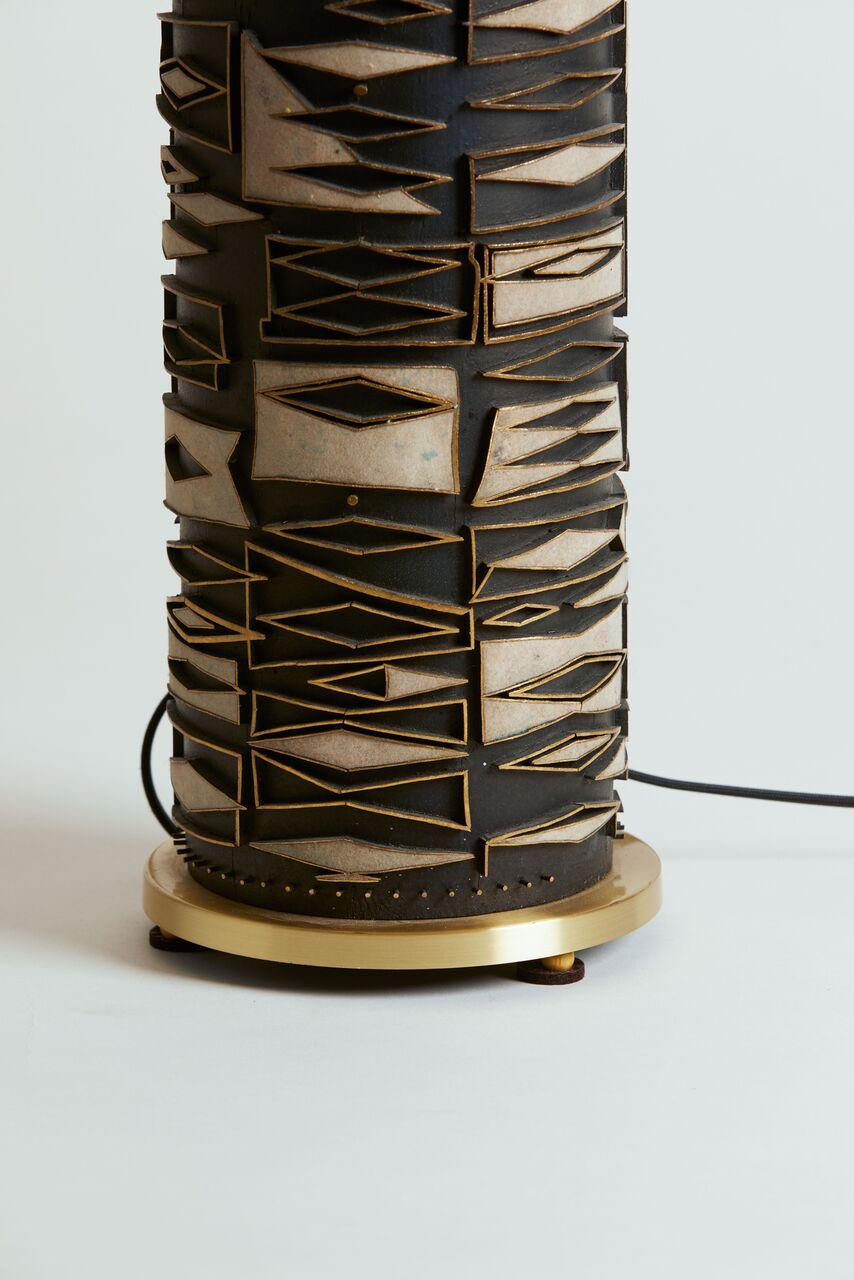 1980s, Italy signed metal and pottery lamp in black and brass. Table lamp signed by Svensk Vara.