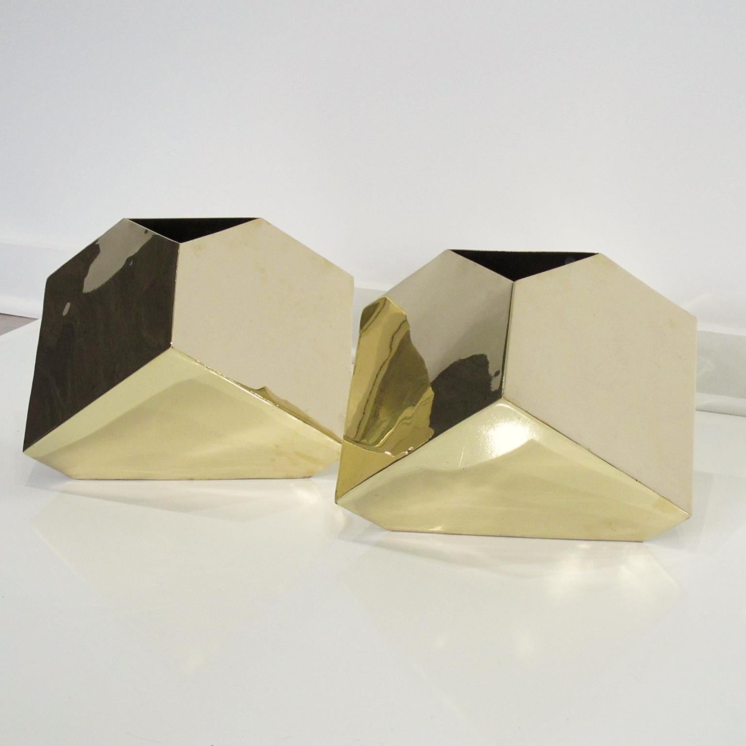 Beautiful 1980s pair of Postmodernist sleek cubist brass vases by James Johnston. High gloss polished heavily gilded brass vases with an impressive cutting edge sleek architectonic design form and small triangle opening. They can also be used as
