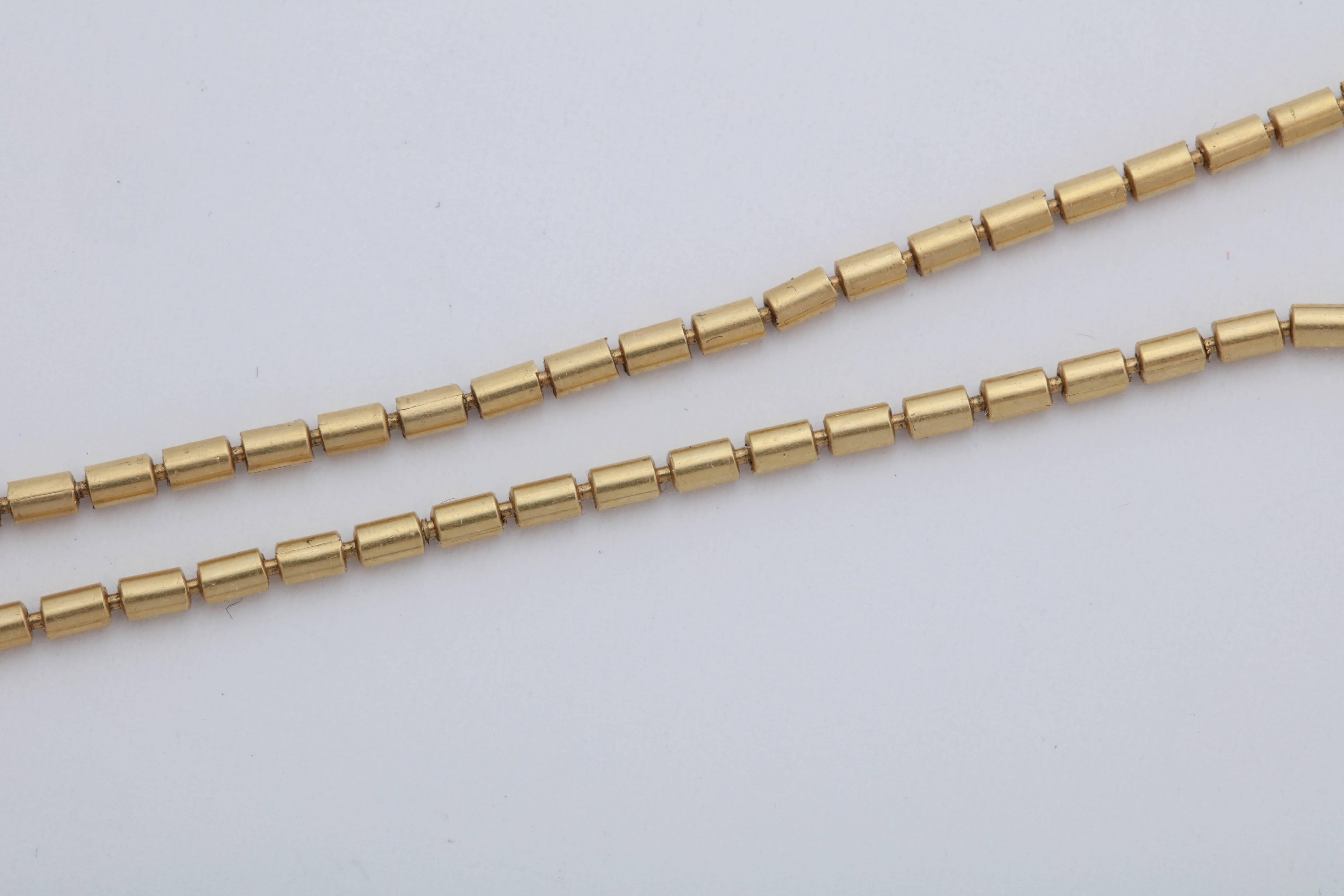 1980s Jan Yager Cool and Hip Reversible Long Pillow Bead and Gold Chain Necklace In Excellent Condition In New York, NY