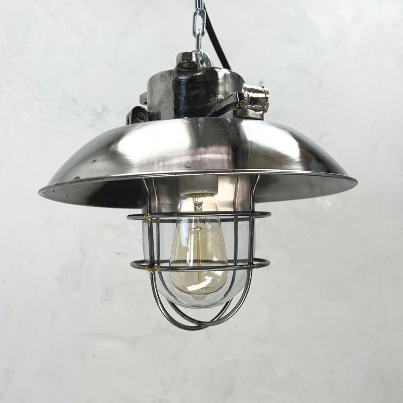 1980's cast steel explosion proof ceiling cage light originating from Osaka Japan made by Kokosha.

Kokosha were established in 1915 Osaka Japan. They manufacture marine fixtures & fittings for the shipbuilding field. These vintage ceiling light