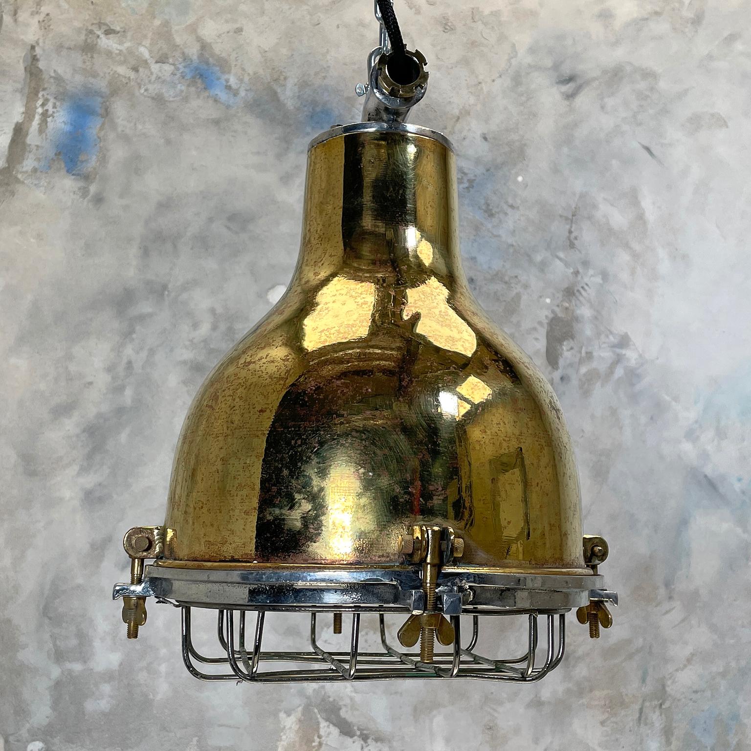 A vintage brass marine industrial ceiling pendant light with cage originating from Japan made in the 1980's. Reclaimed and professionally restored to modern lighting standards and ready for contemporary interiors.

Specifications
Width: