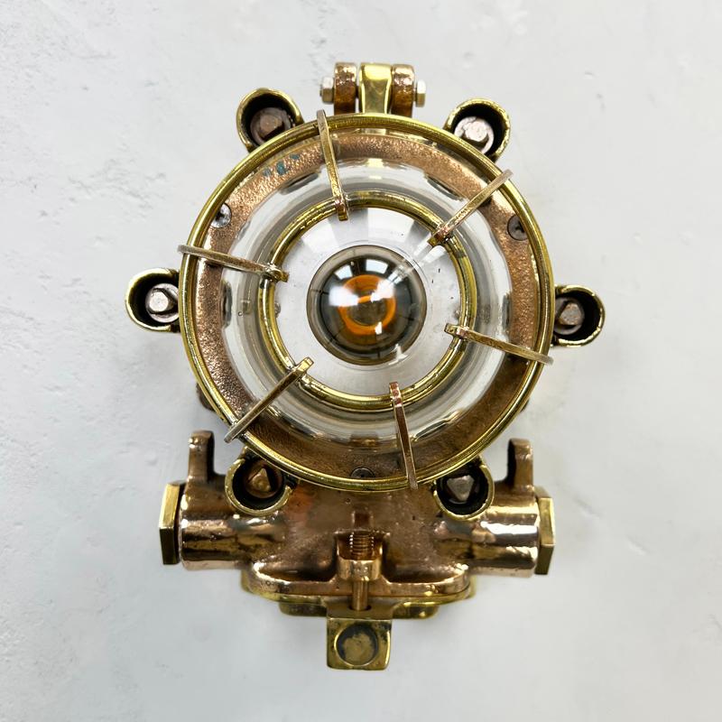 A vintage industrial outdoor solid phosphor bronze flameproof bulkhead wall light by Morio Denki. 
 
Reclaimed nautical bulkhead wall lights, professionally restored by hand in UK by Loomlight to modern lighting standards. 
 
Specifications
Width: 