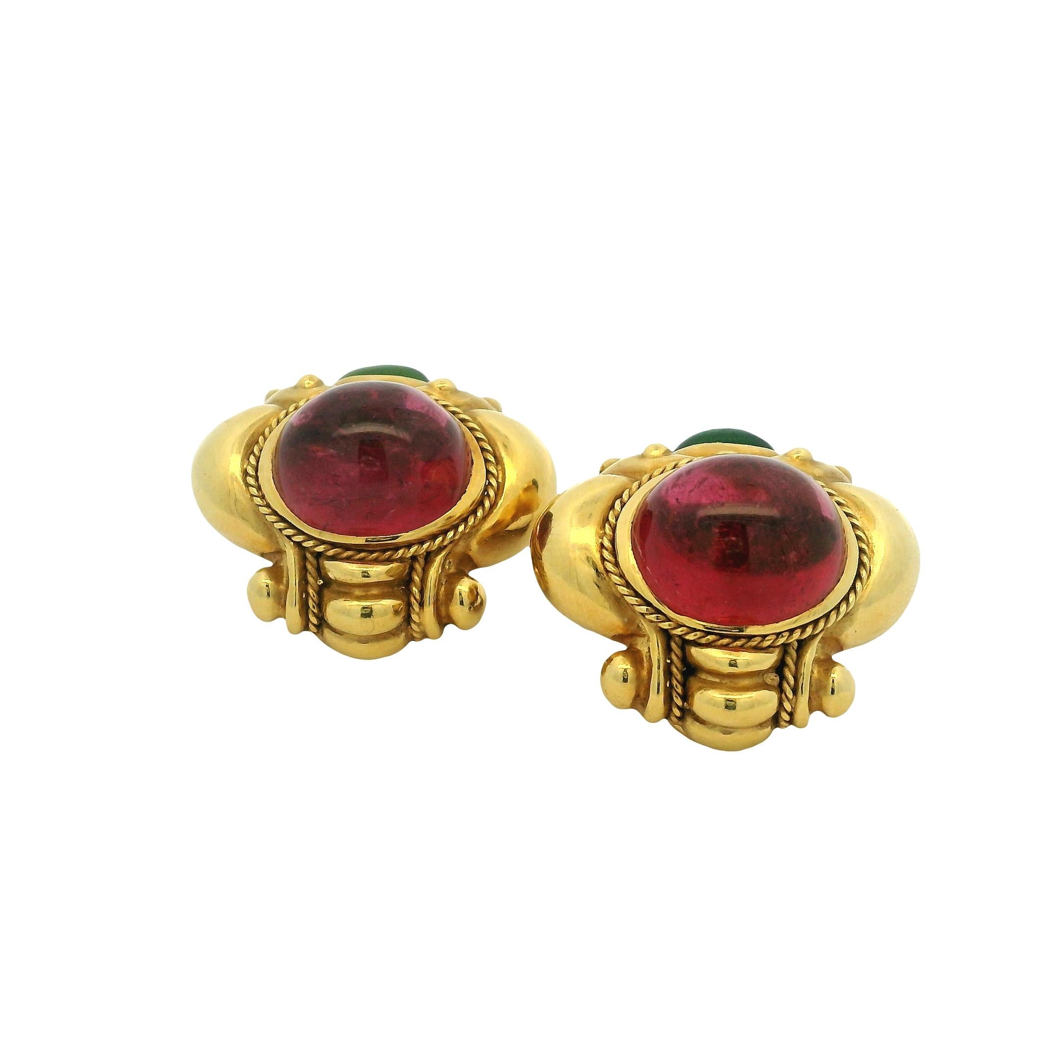 Bold and sculptural, these vintage 1980s earrings by JBC are crafted in rich 18K yellow gold and set with vivid cabochon-cut tourmalines. Each earring features a vibrant raspberry pink tourmaline center stone, framed by twisted gold rope detailing