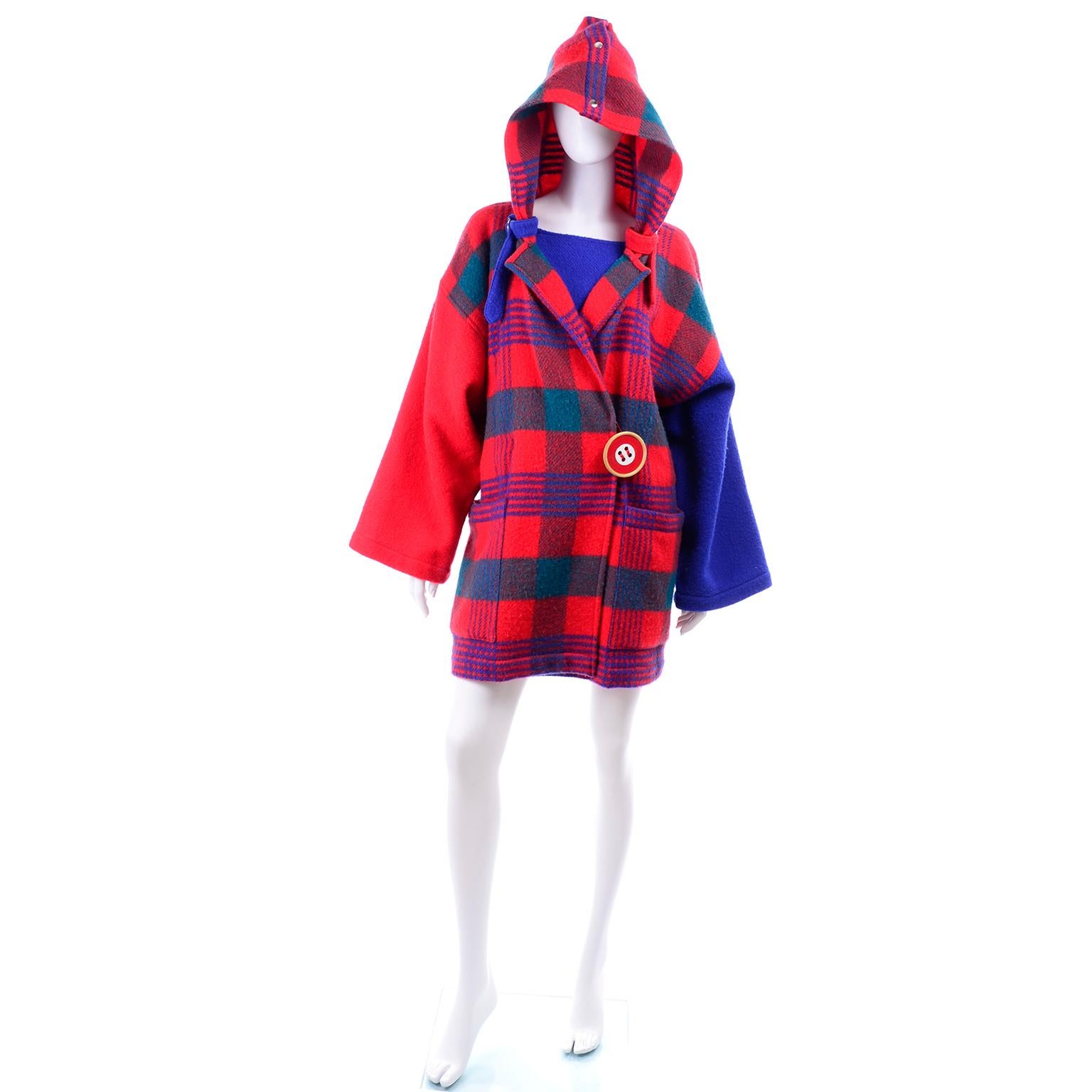 This vintage coat was designed by Jean Charles de Castelbajac in the 1980's and was sold at Bergdorf Goodman.  The coat is in a beautiful red and blue plaid wool and has a fabulous 3