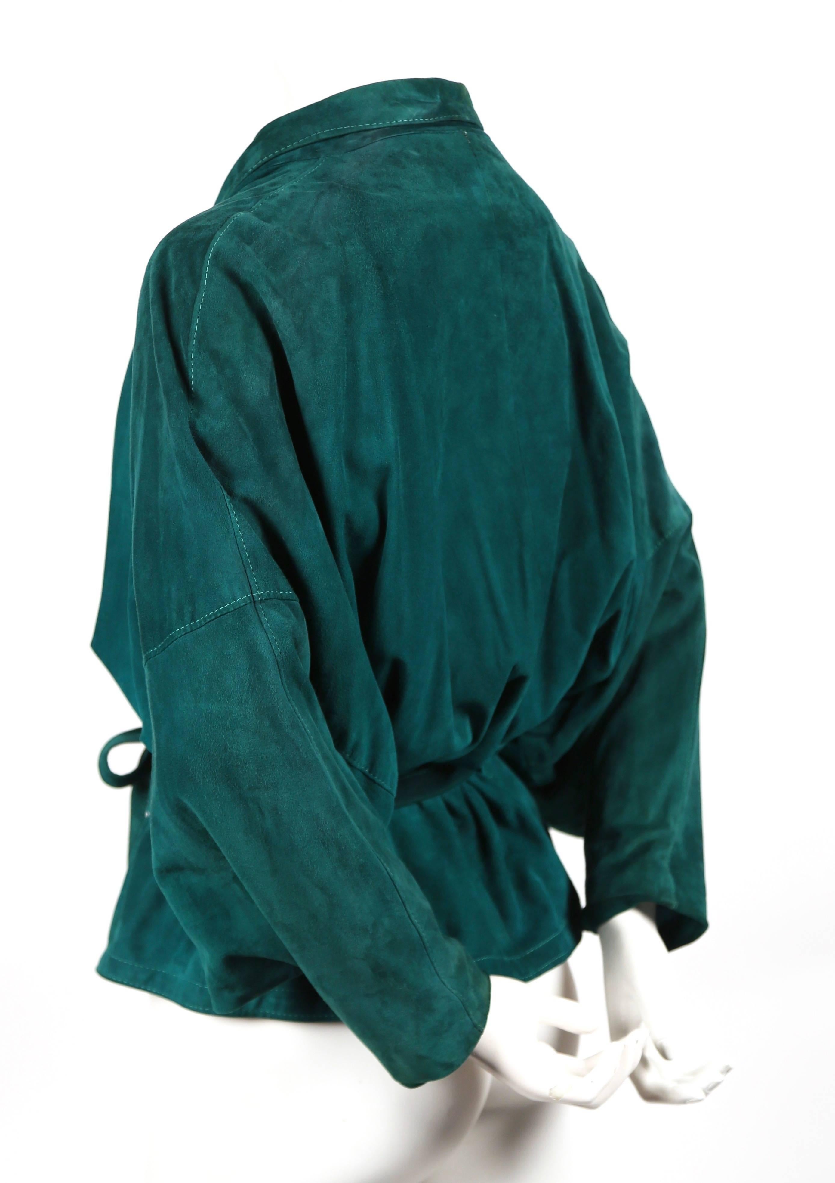 Emerald green draped suede jacket with wrap closure from Jean-Claude Jitrois dating to the early 1980's. Fits a size 4 to 8. Fully lined. Wrap, belt closure. Made in France. Good condition.

