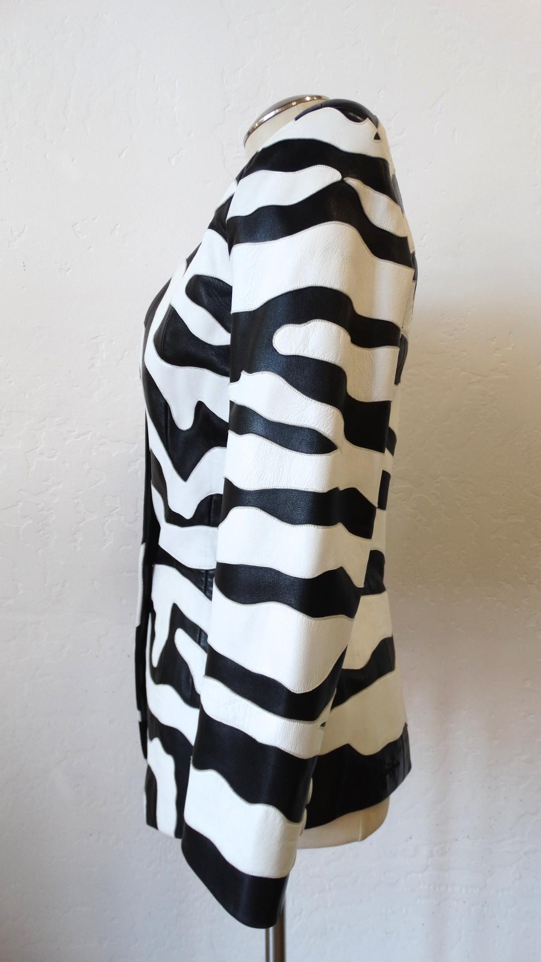 Feel All Of The 80s Vibes In This Amazing Jean Claude Jacket! Features pieced leather applique in black and white zebra stripes and a hidden zebra face, complete with a detailed ear. Shoulder pads and a nipped-in waist create a strong silhouette