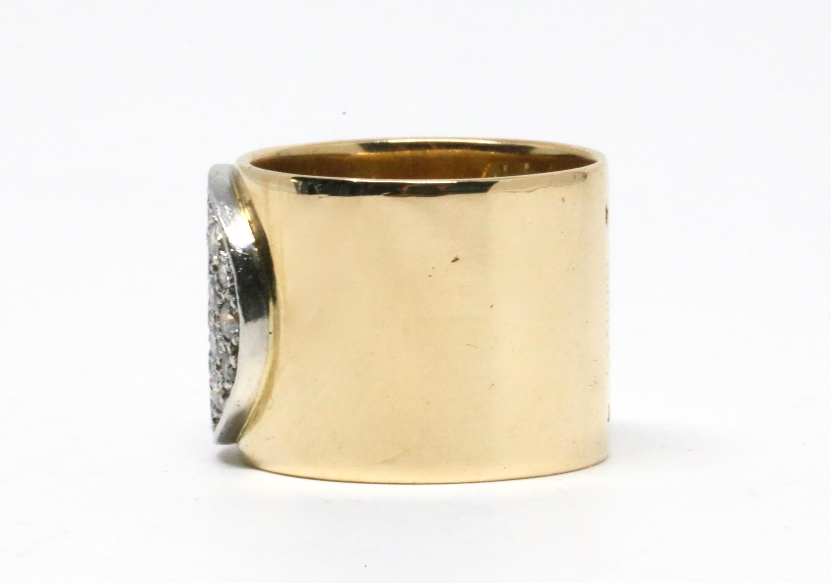Early example of the' Anthéa' ring in 18k yellow gold with 30 diamonds designed by Jean Dinh Van dating to the 1980's. Center of ring falls at an American size 7 however due to the thickness of the band (16mm), this ring best fits a size 6 to 6.5