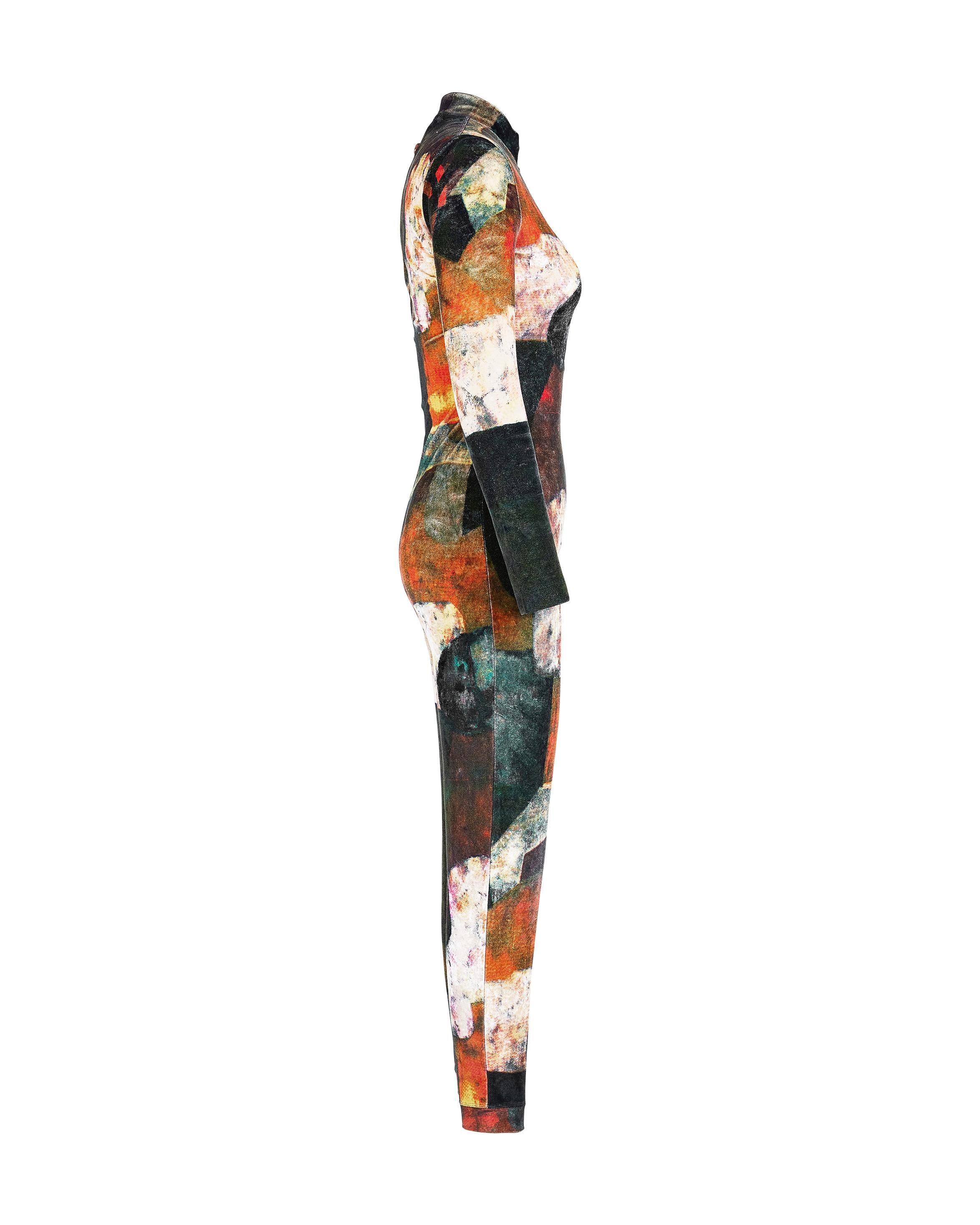1980's Jean Paul Gaultier 'Maille' Robert Delaunay printed zip-up jumpsuit/catsuit. Rare 1980's Gaultier piece featuring print by artist Robert Delaunay. Half-zip mock neck catsuit with abstract print throughout. Moderately stretchy material; feels
