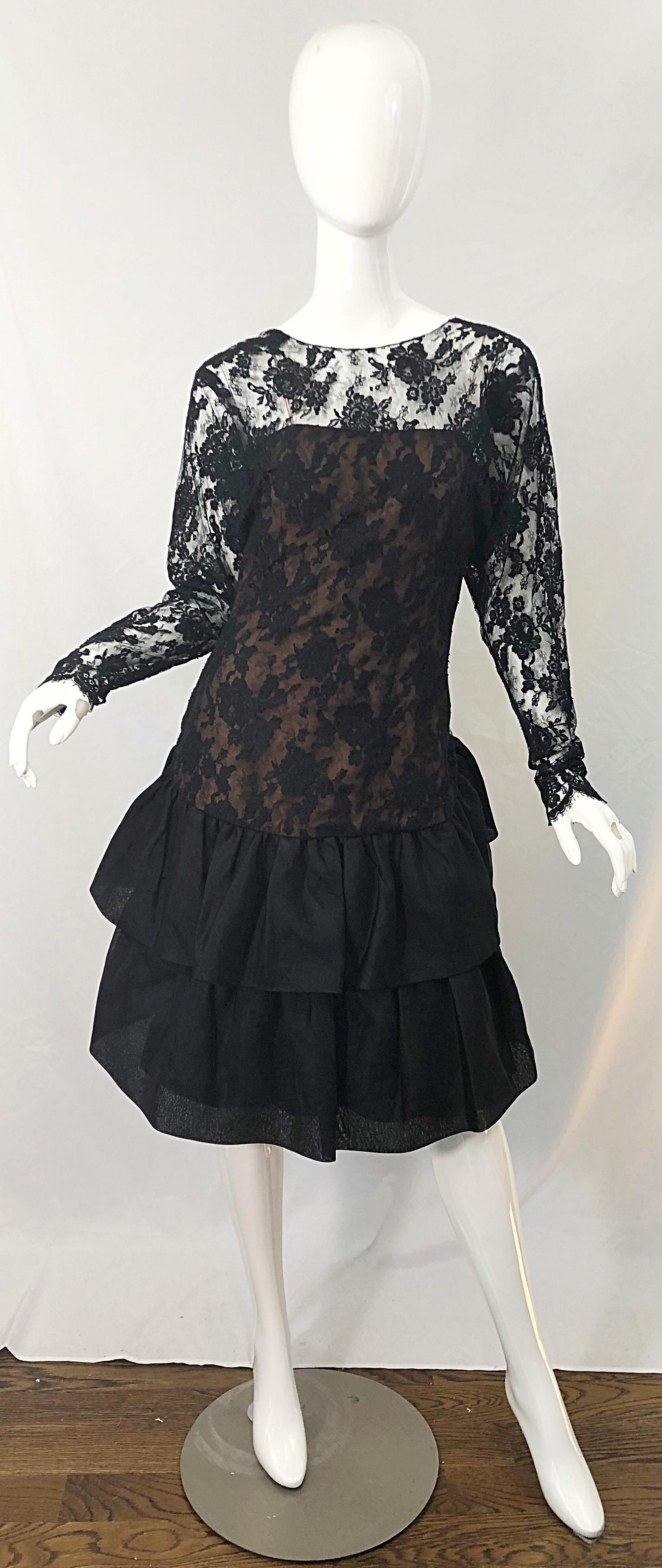 Beautiful Avant Garde 1980s JILL RICHARDS black and nude French lace and silk chiffon long sleeve cocktail dress ! Features a nude underlay on the bodice, with black French lace over. Chic dolman sleeves, and a two tiered skirt. The back of the