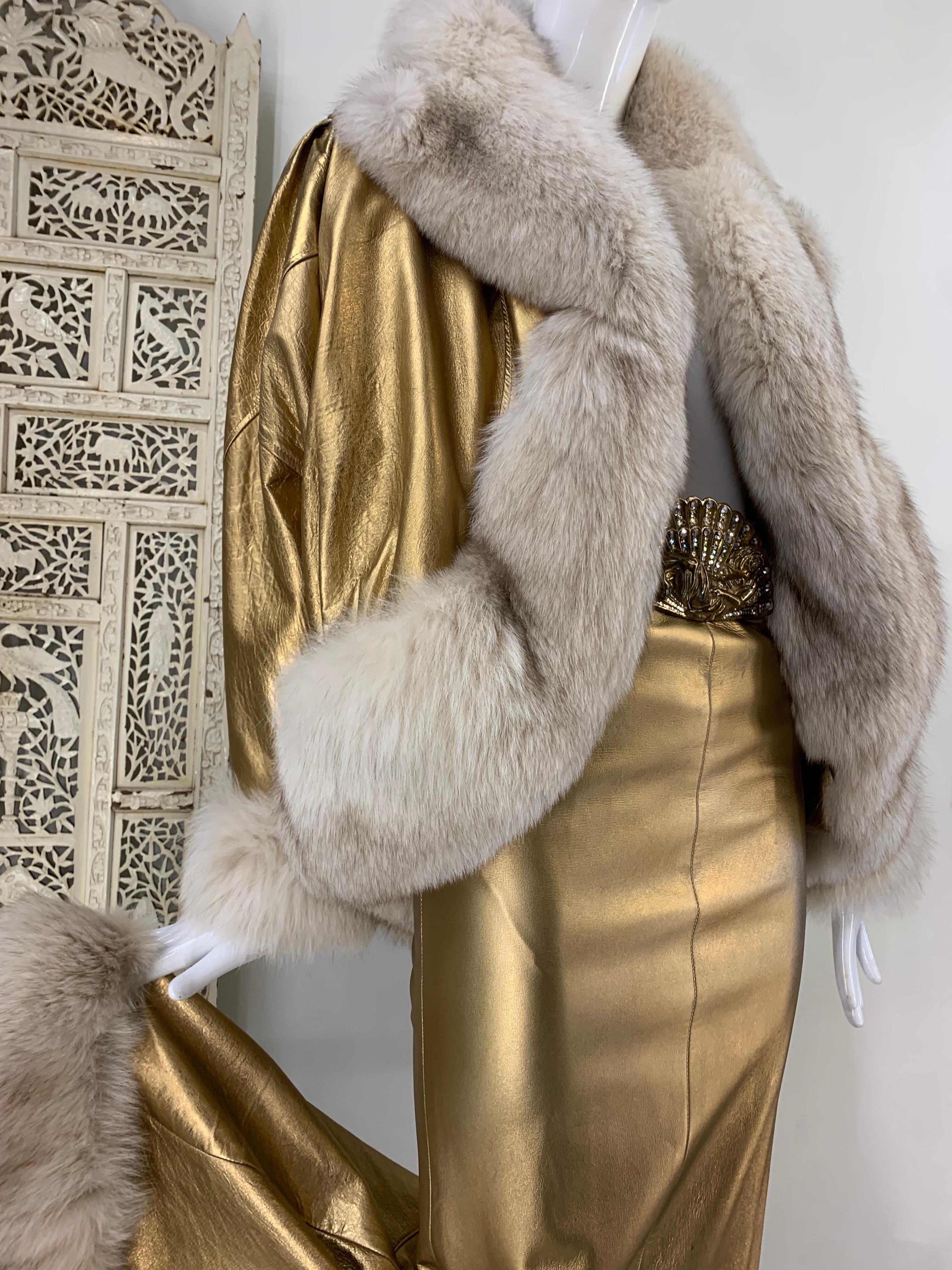 1980s Jitrois Matte Gold Leather Fishtail Skirt & Cocoon Coat Edged in Lush Fox: Jean-Claude Jitrois holiday fantasy ensemble with coordinating belt with large fan-shaped buckle. Dramatic Dolman sleeve cocoon coat will keep you warm for a holiday