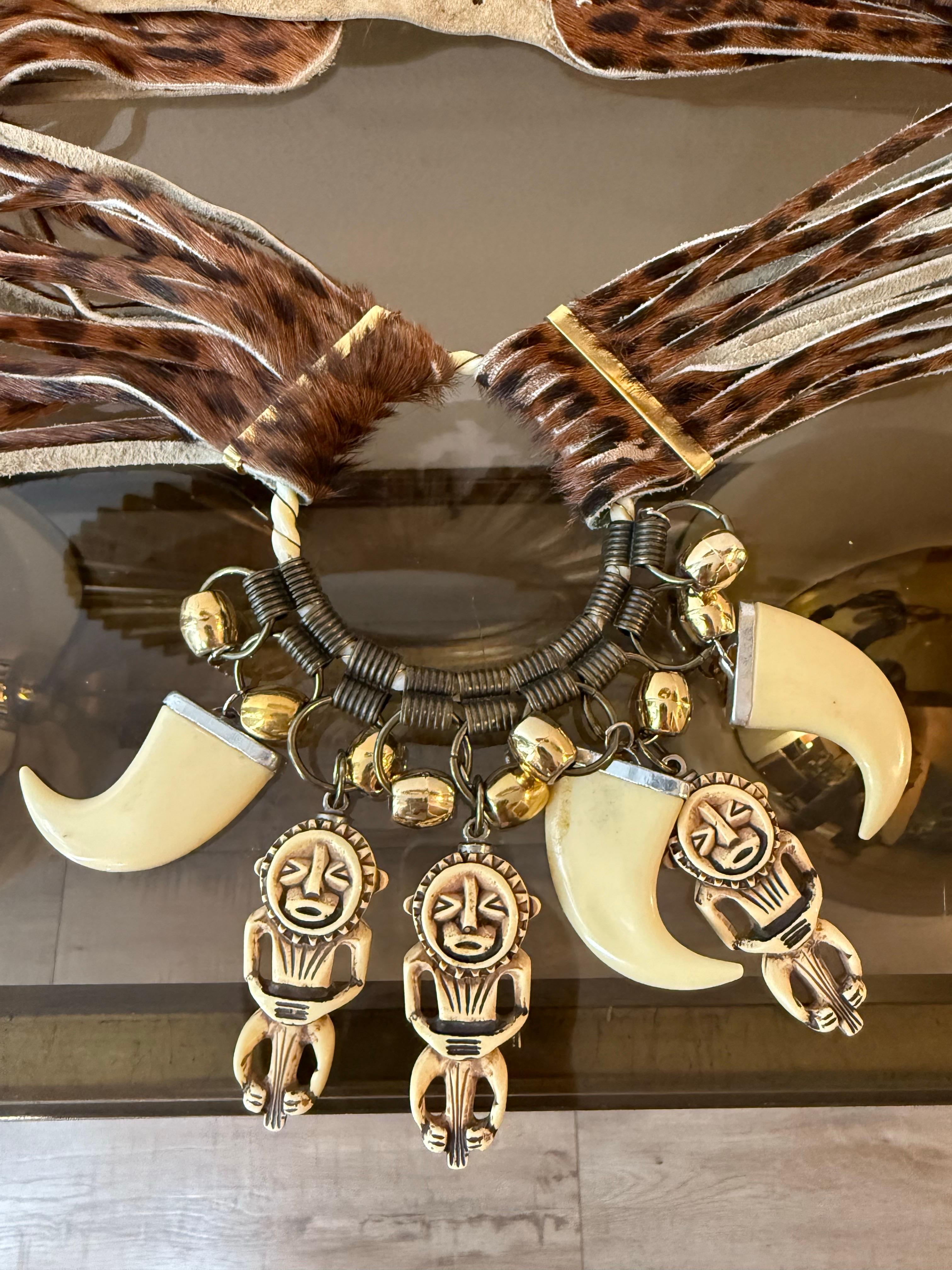1980s Jose Cotel Leopard Print Cowhide Belt w Resin Bear Claw & Native Charms:  Belt is slit cowhide in multiple narrow bands with a circular metal centerpiece and dangling resin Kachina doll charms. Buckle back and made to be worn at hip. US size