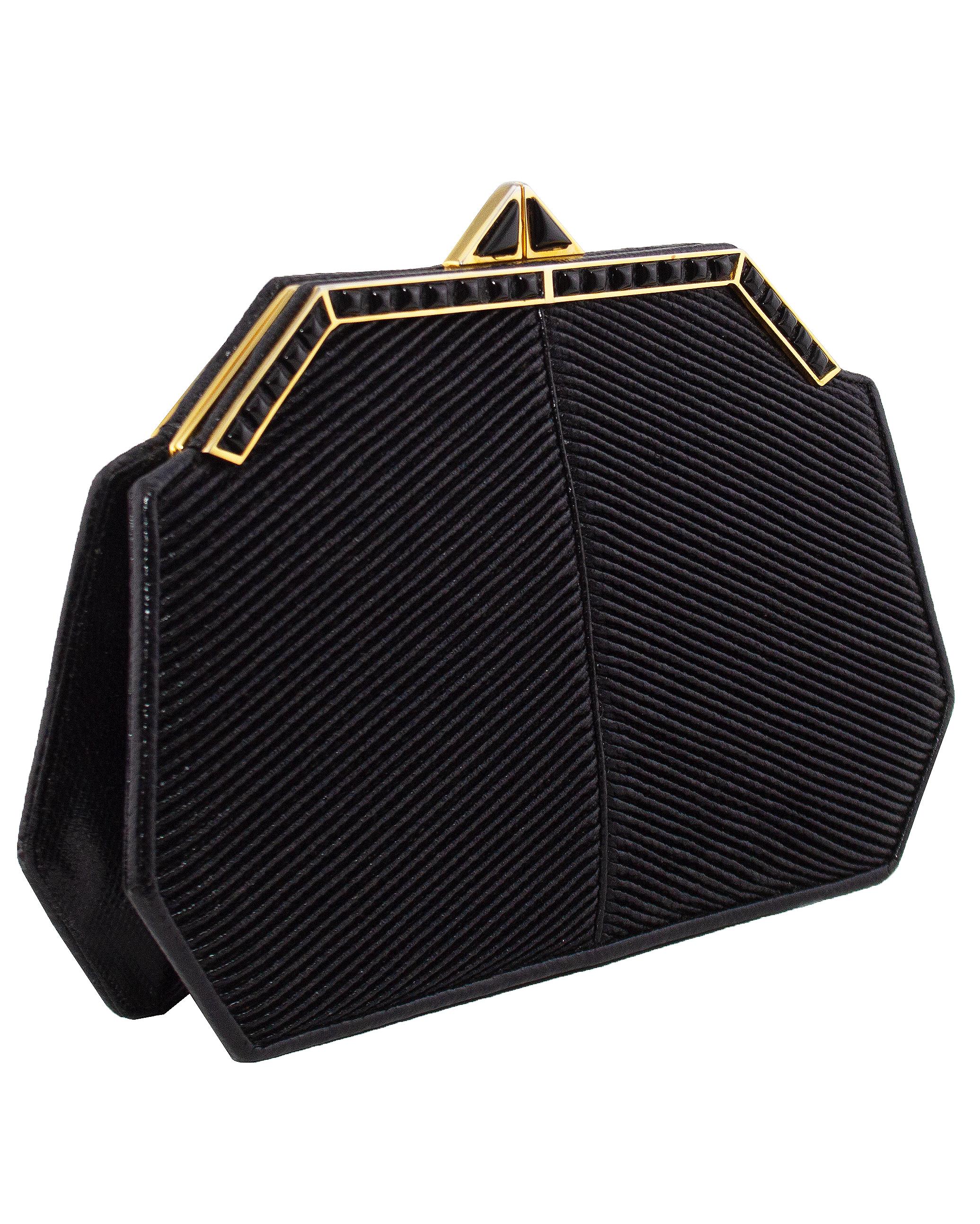 Stunning art deco inspired Judith Leiber frame clutch from the 1980s. Diagonally ribbed black courderoy style leather body with black reptile effect sides, base and trim. Contrasting gold tone metal frame with black square cabochon details and a