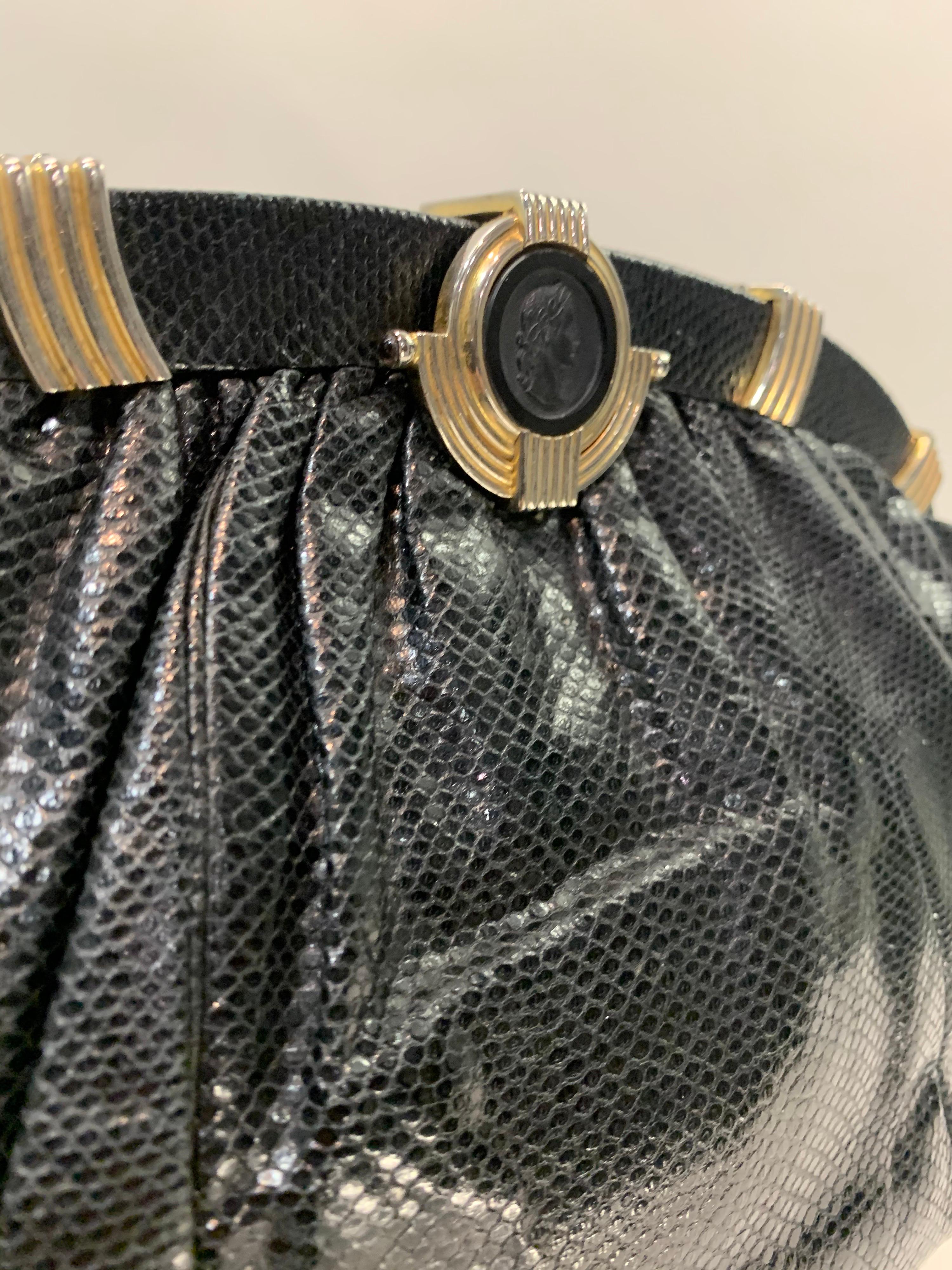 1980s Judith Leiber oval black lizard skin convertible clutch handbag with obsidian cameo clasp. Optional chain handle disappears into bag for clutch. Size Large.