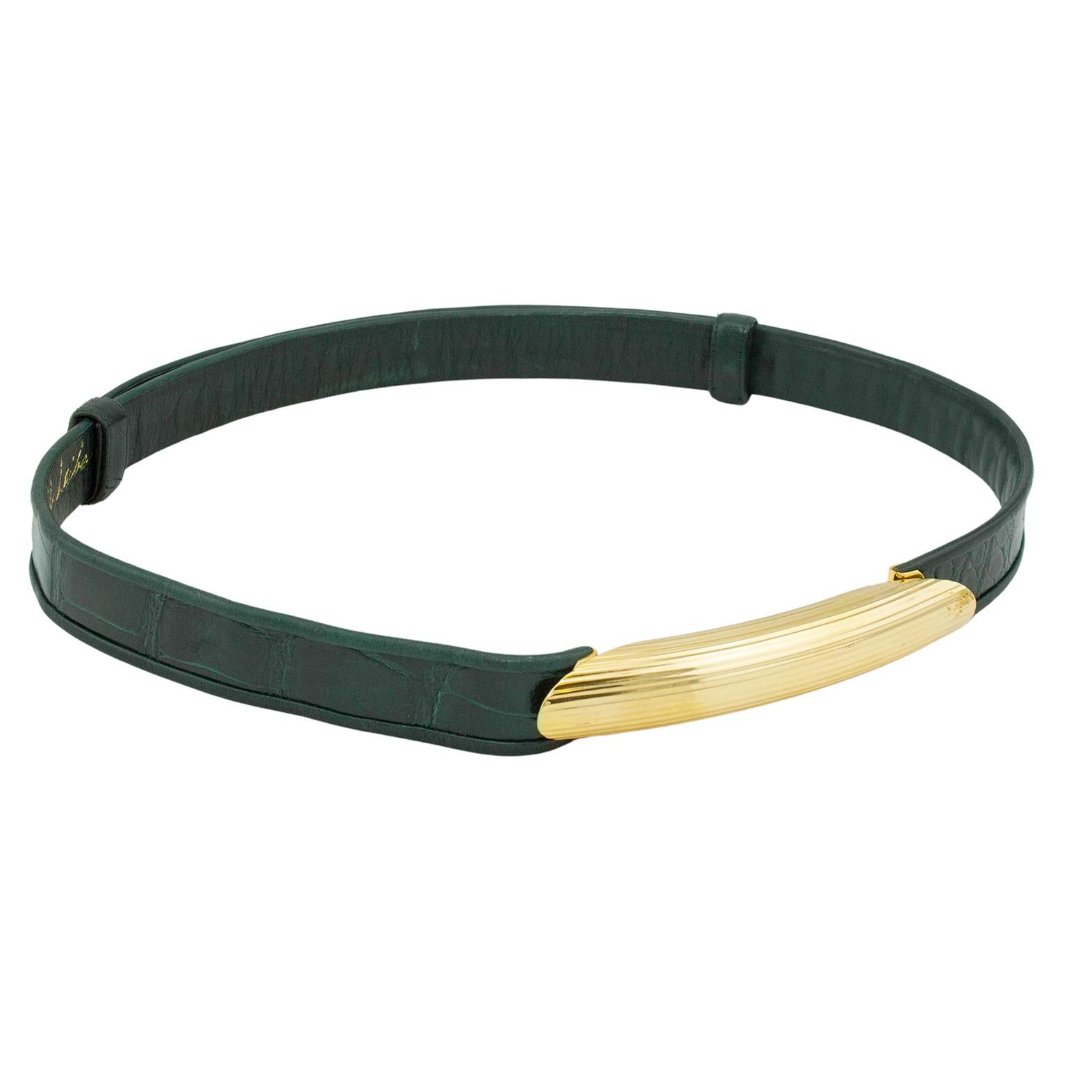 Stunning 1980s Judith Leiber hunter green patterned leather thin belt. Gold tone ribbed metal tubular buckle detail. Buckle closure is metal hook and eye. Green leather interior with gold brand stamp. Adjustable - 40