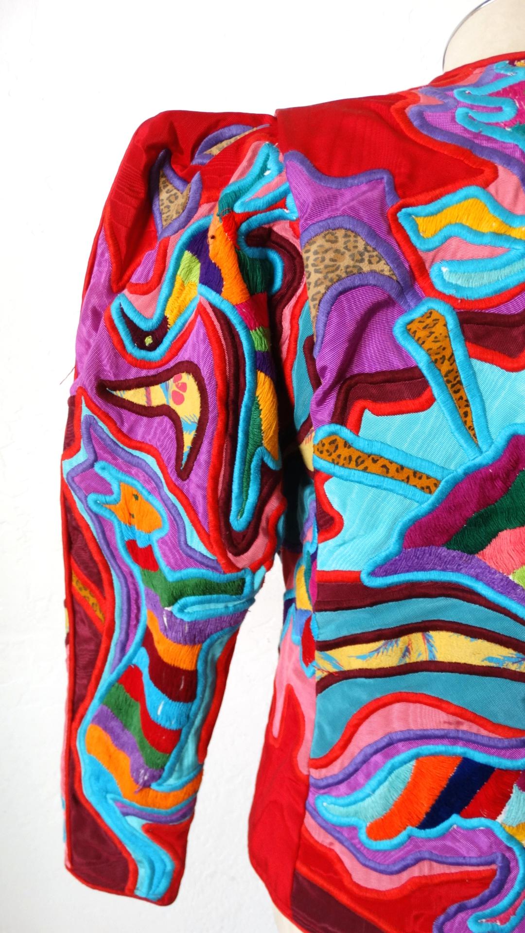 The Most Unique Jacket Is Here! Circa 1980s, this Judith Roberts jacket features amazing appliqué patchwork made up of abstract designs in bright colors, and a variety of beautiful fabrics. Includes large silver buttons with small polka dots and an