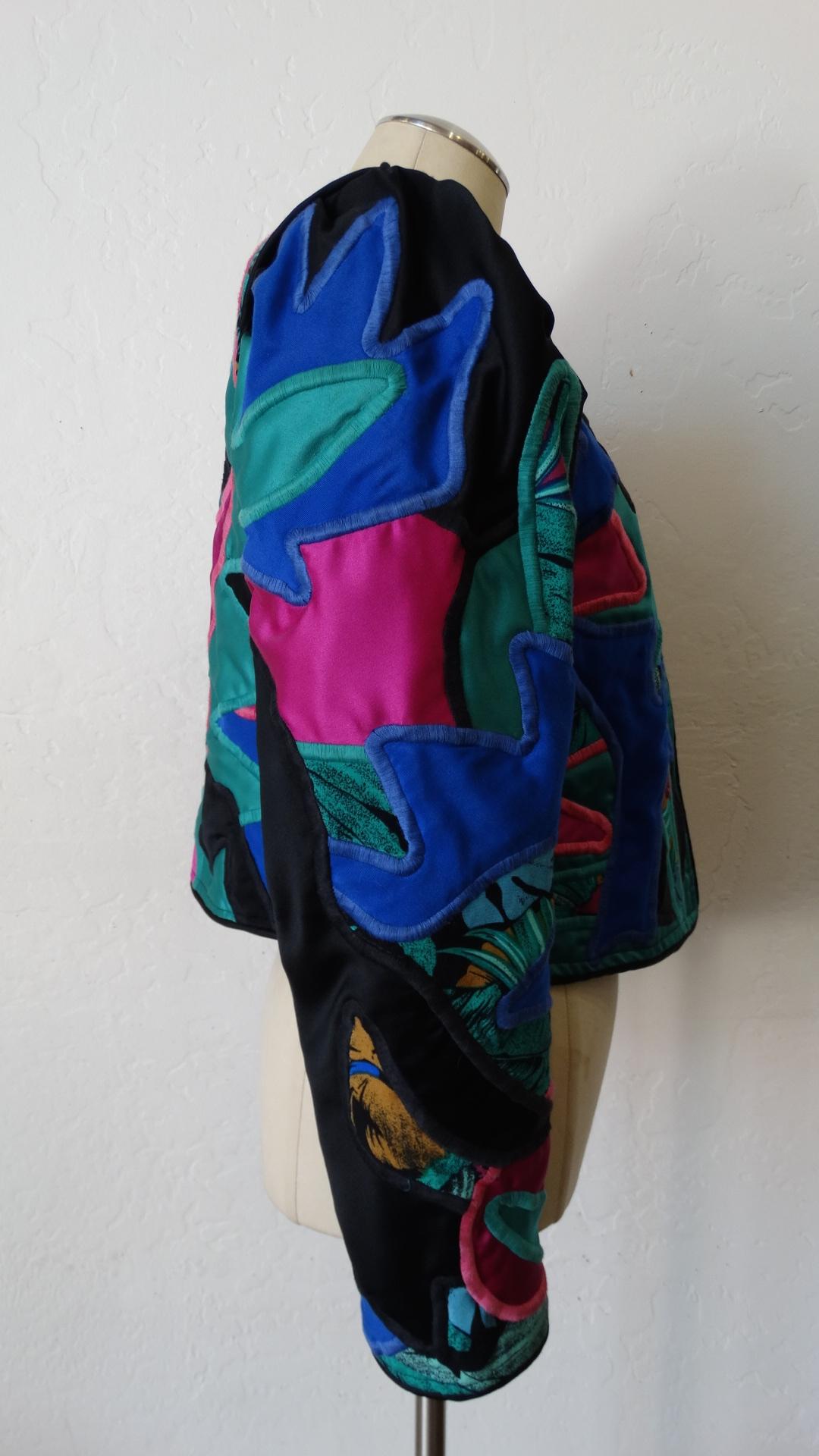 The Most Unique Jacket Is Here! Circa 1980s, this Judith Roberts jacket features amazing appliqué patchwork made up of abstract designs in bright colors and beautiful tropical greenery fabrics. Includes puffed long sleeves and great structure.