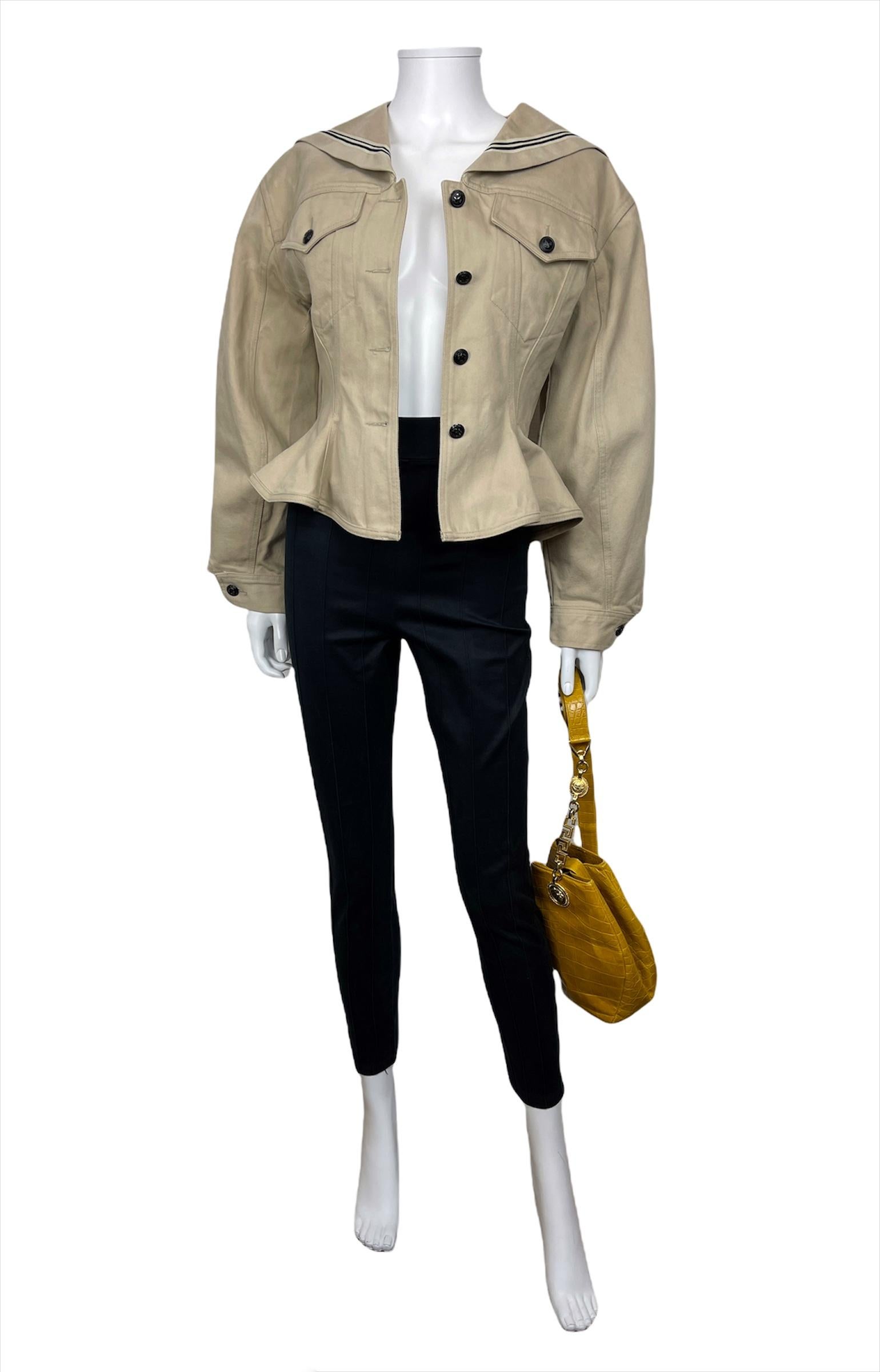 JUNIOR JEAN PAUL GAULTIER, Made in Italy, Spring-Summer 1989.
This long-sleeves jacket designed in beige cotton canvas has been presented in Jean Paul Gaultier Spring-Summer 1989 runway named 