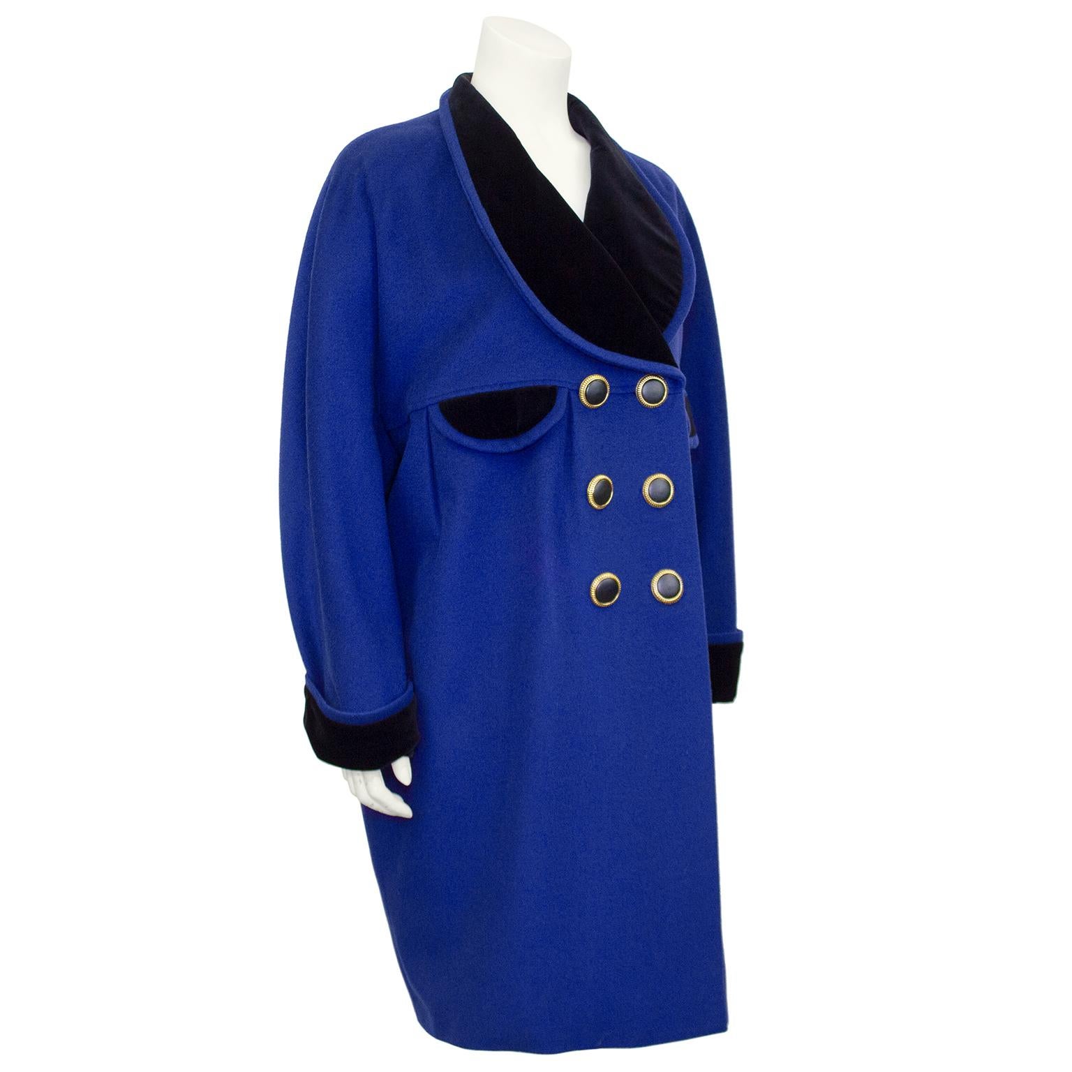 Great Karl Lagerfeld cocoon style coat from the 1980s. Royal blue wool with contrasting black velvet over sized shawl collar, cuffs and demi lune faux pocket flaps. Double breasted with large gold tone metal and black buttons. Beautiful draping with
