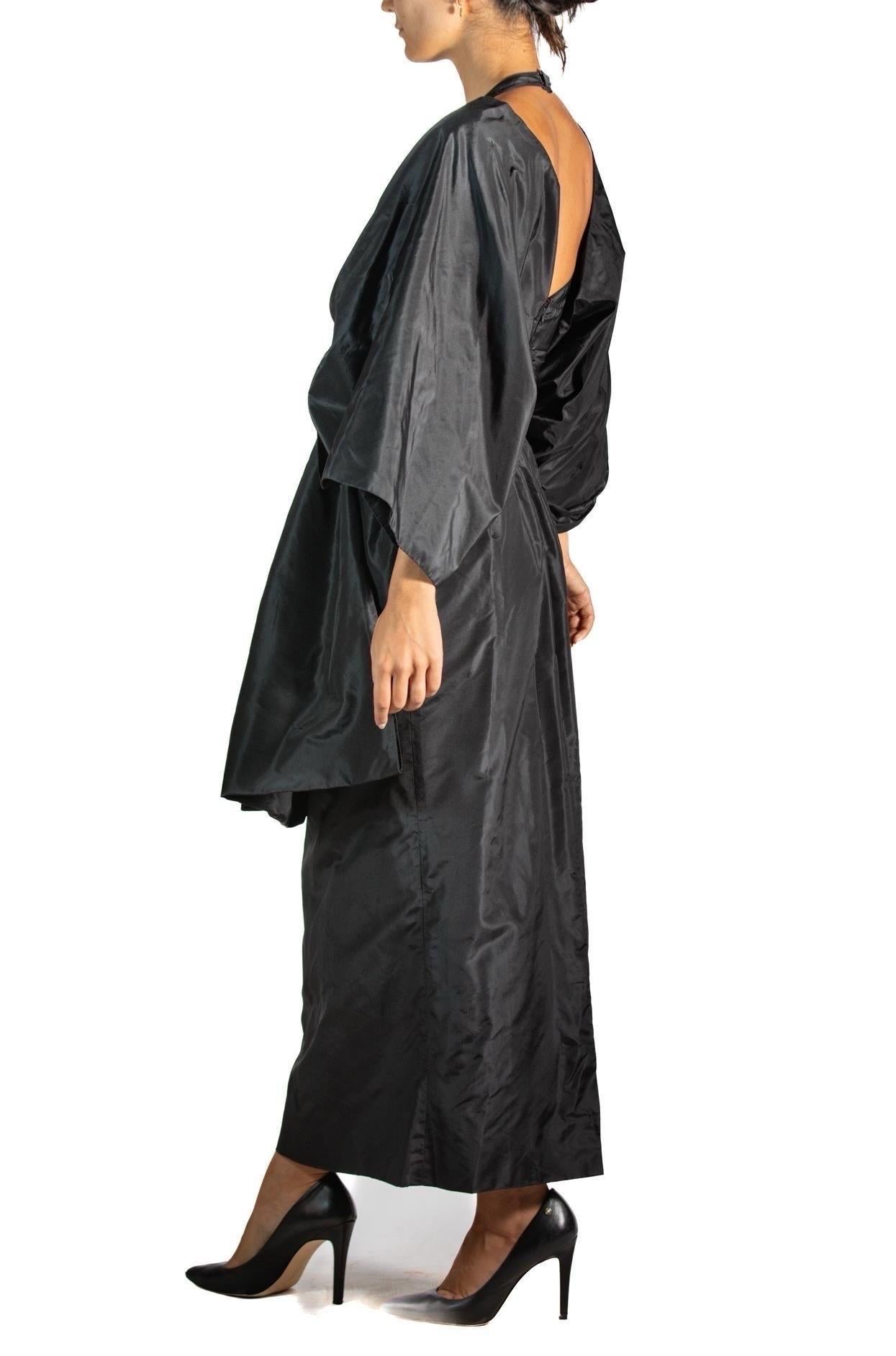 From the iconic and legendary collection which featured the whimsical beaded trompe l'oeil dresses. This gown doesn't need any whimsy to make a bold statement. Instead the look is as though the wearer is tied up in a big bow as a present herself. 