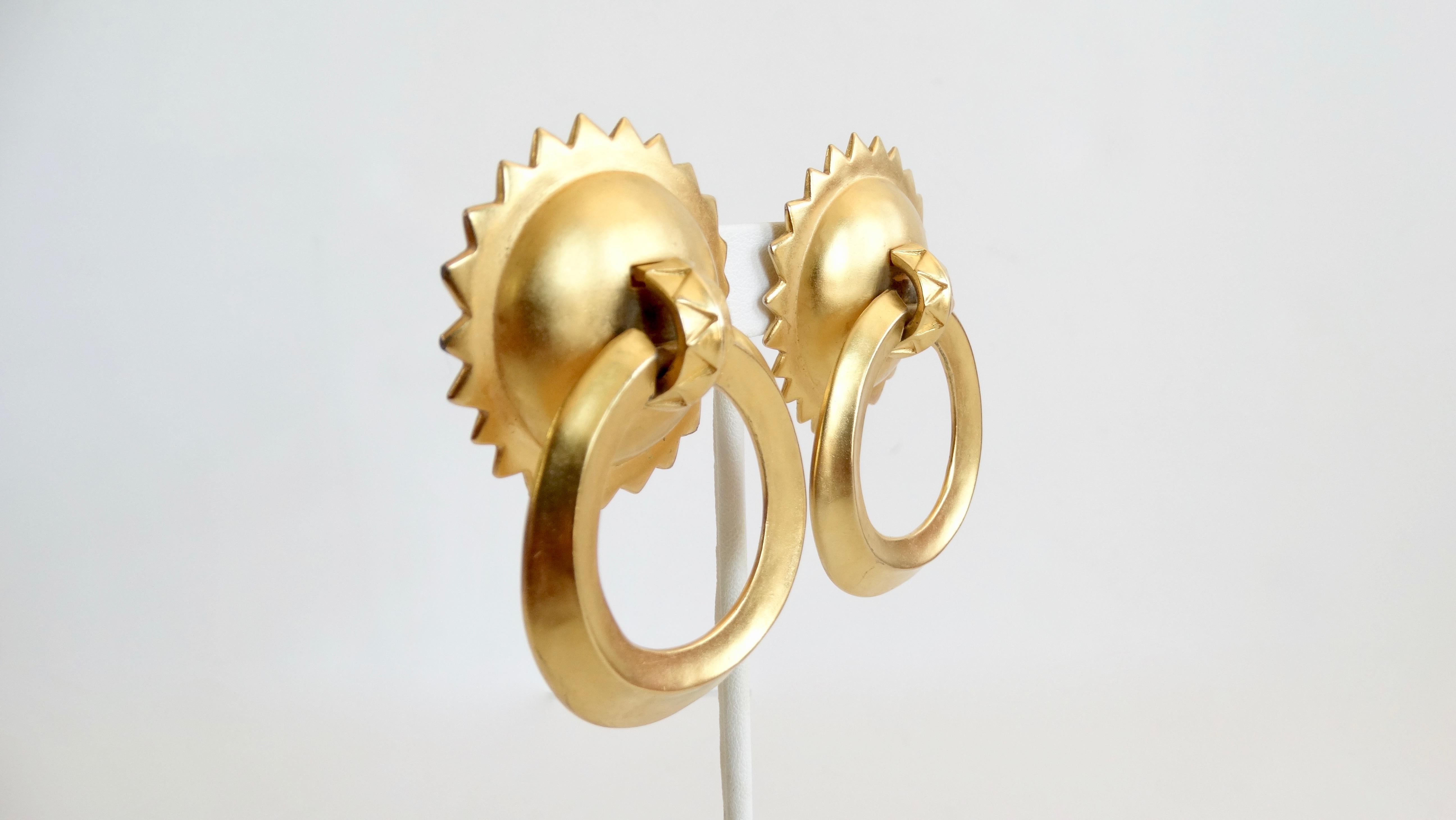 Snag yourself a piece of jewelry made by a fashion legacy! Circa 1980s, these Karl Lagerfeld door knocker earrings are gold plated and feature pointed trim detailing. Includes clip-on closures. The perfect pair of earrings to pair with any look! 