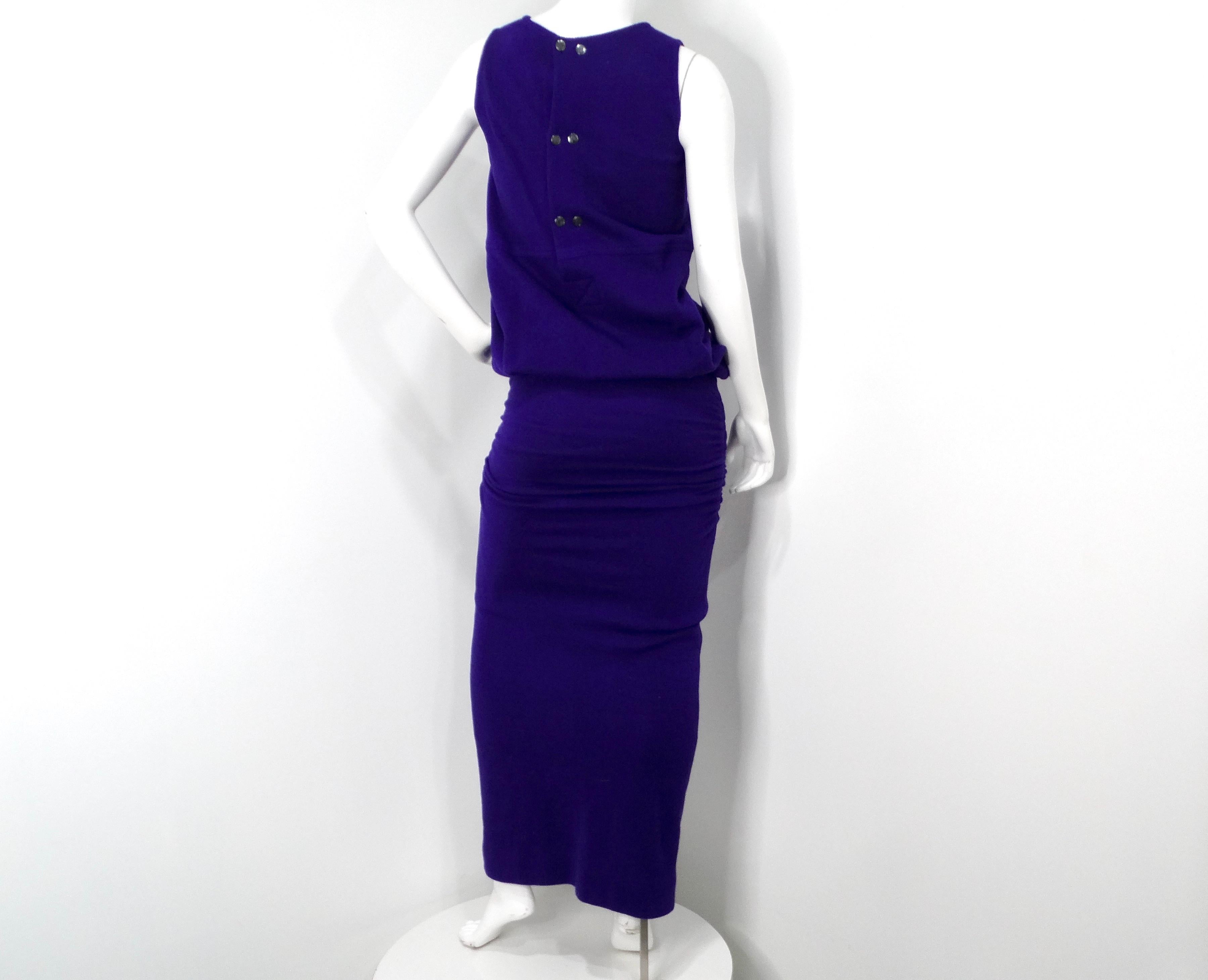 The 1980s Karl Lagerfeld Royal Purple Wool Ruched Maxi Dress is a stunning example of the iconic designer's mastery of haute couture. This show-stopping maxi dress is crafted from wool fabric in a deep, regal purple hue that exudes luxury and