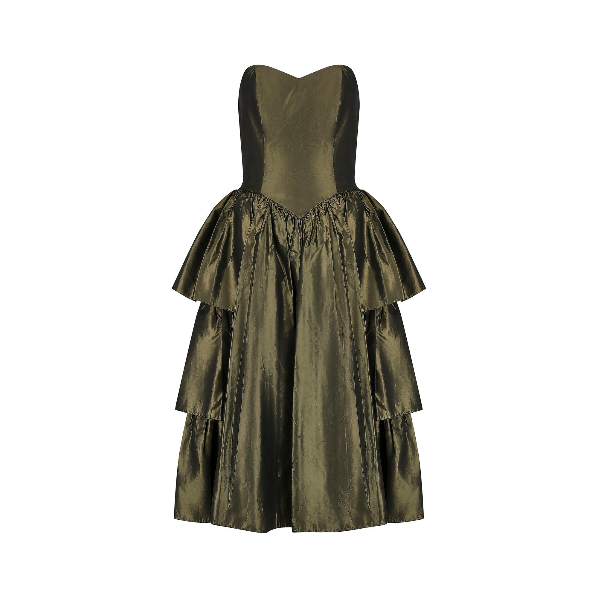 Fantastic example of late 1980s and early 1990s partywear by a short lived, high quality boutique label called Katerina. It's British made from acetate taffeta in a deep olive green.  The fabric is such good quality that we thought it was silk,