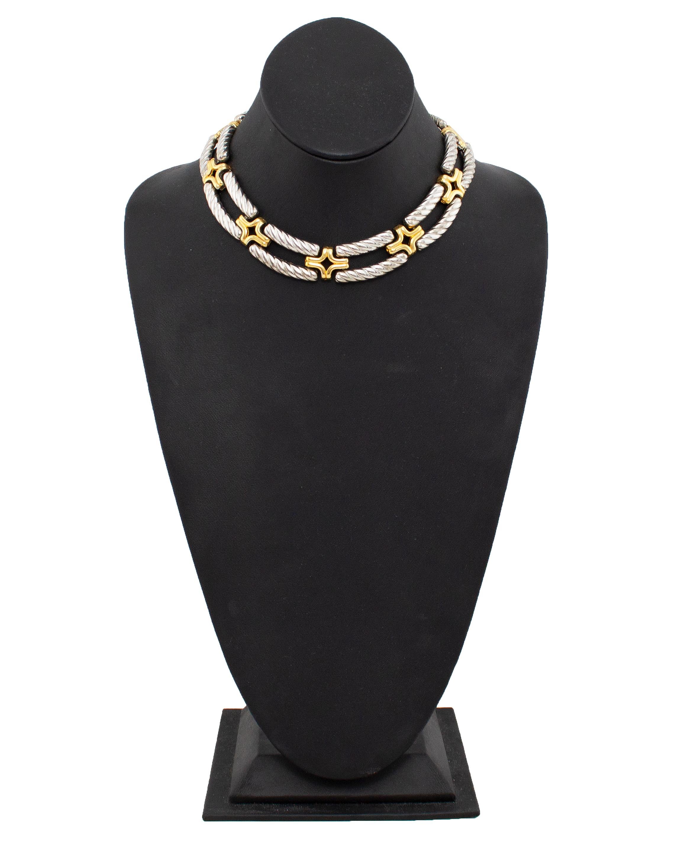 Fabulous 1980s Kenneth Jay Lane necklace. Twisted rope style silver tone metal with gold tone metal cross details. Choker style, this necklace sits tight to the neck but is lightweight and does not feel heavy when wearing. KJL marking on the back of
