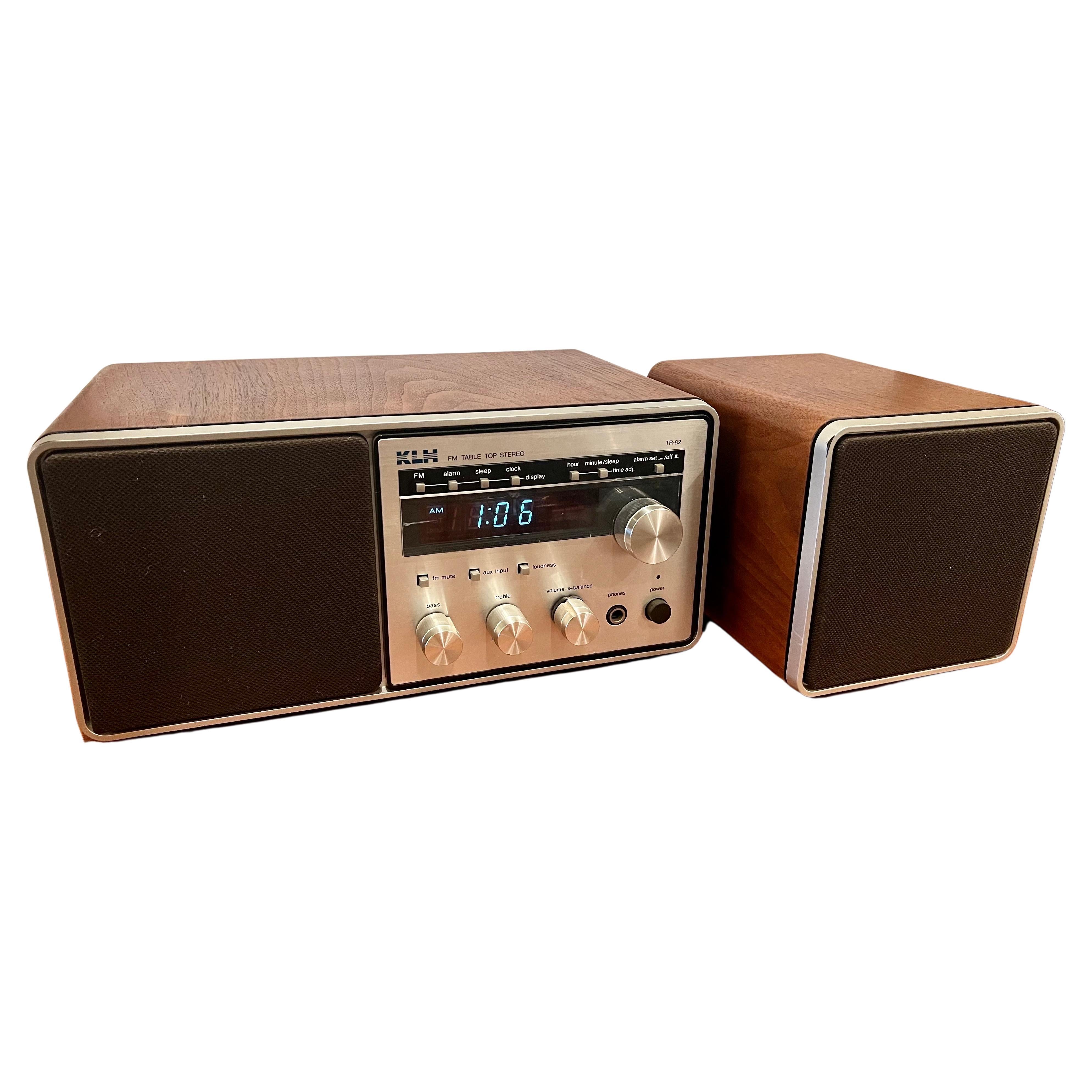 Great design on this cool KLH FM tabletop stereo, circa the 1980s made in Japan, beautiful walnut case nice clean condition in working condition a little static when you up the volume but nothing major with auxiliary speaker and extra outputs for a