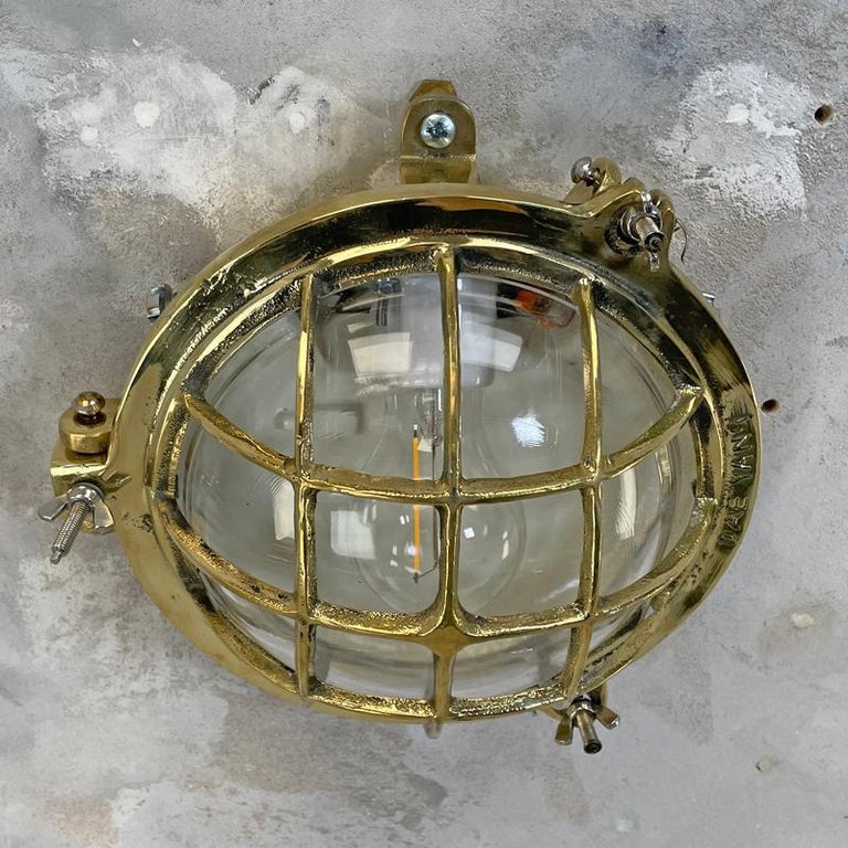 1980's Korean Brass Circular Bulkhead Light with Cast Cage and Glass Shade For Sale 5
