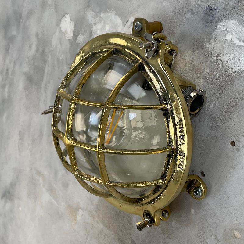 1980's Korean Brass Circular Bulkhead Light with Cast Cage and Glass Shade 4