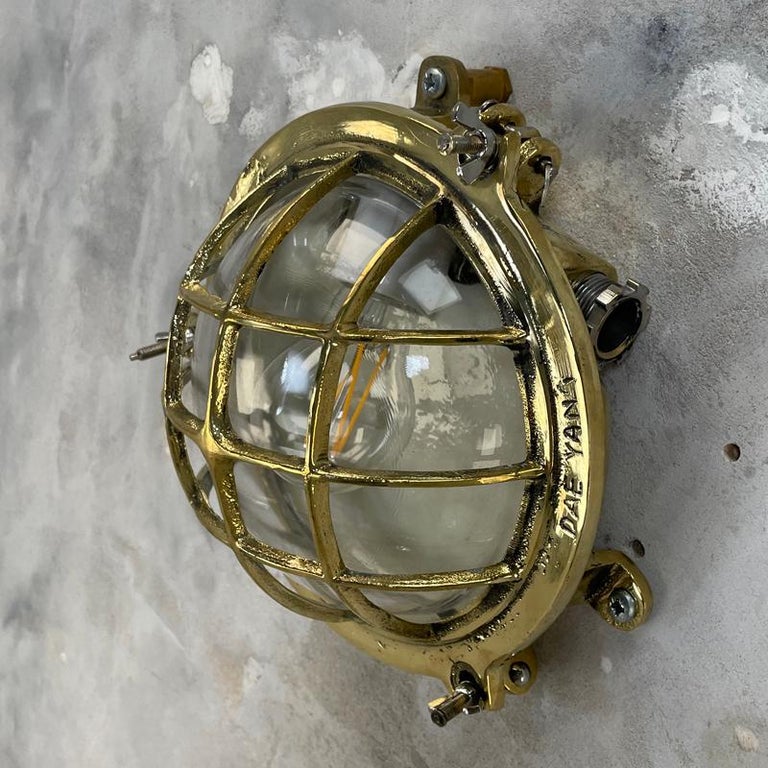 1980's Korean Brass Circular Bulkhead Light with Cast Cage and Glass Shade For Sale 7