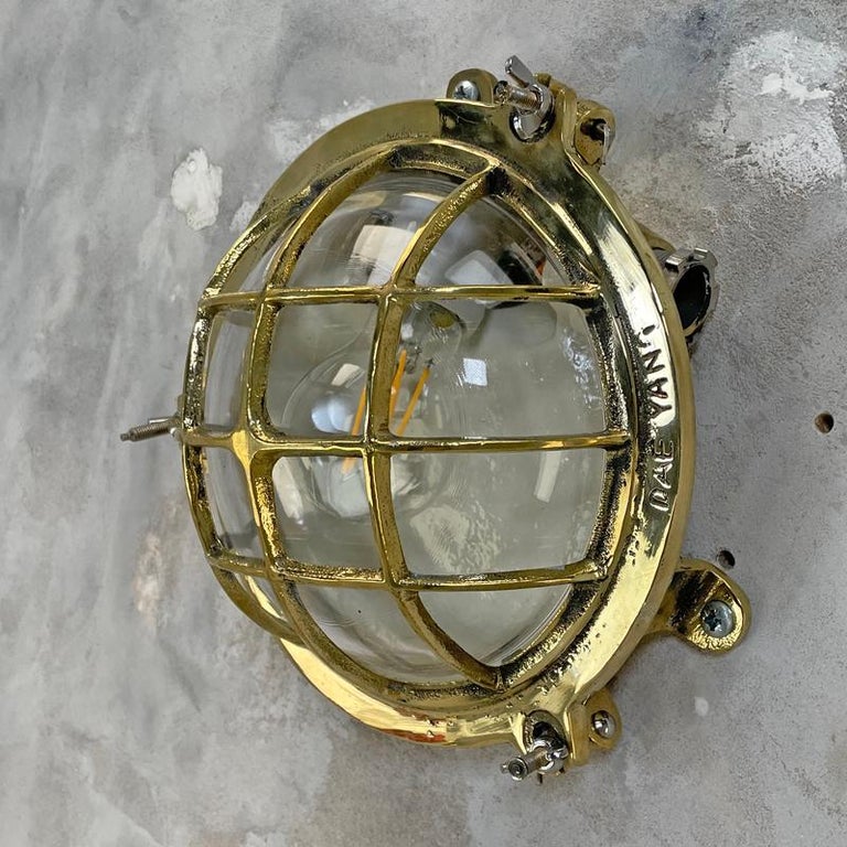 1980's Korean Brass Circular Bulkhead Light with Cast Cage and Glass Shade For Sale 8
