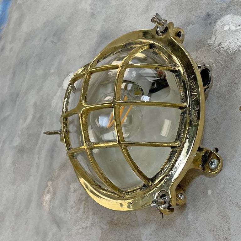 1980's Korean Brass Circular Bulkhead Light with Cast Cage and Glass Shade For Sale 11