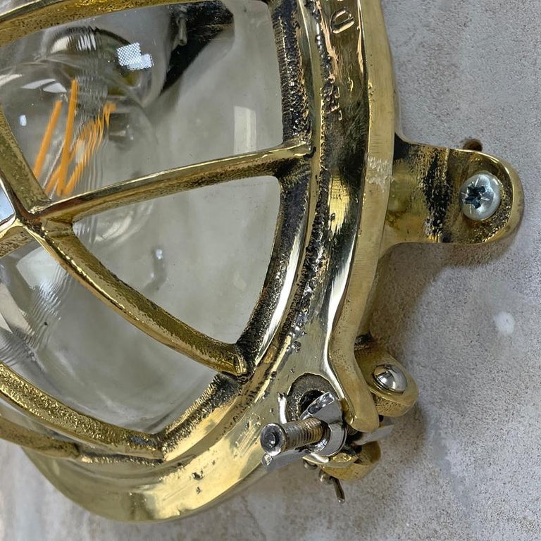 1980's Korean Brass Circular Bulkhead Light with Cast Cage and Glass Shade For Sale 14