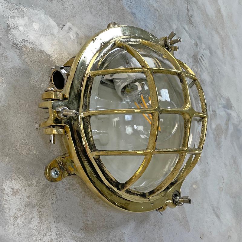 1980's Korean Brass Circular Bulkhead Light with Cast Cage and Glass Shade In Good Condition In Leicester, Leicestershire