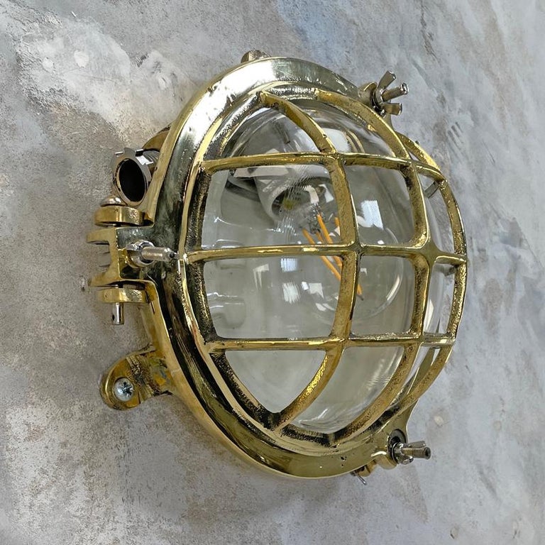 1980's Korean Brass Circular Bulkhead Light with Cast Cage and Glass Shade For Sale 2