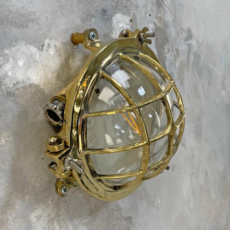 1980's Korean Brass Circular Bulkhead Light with Cast Cage and Glass Shade For Sale 3