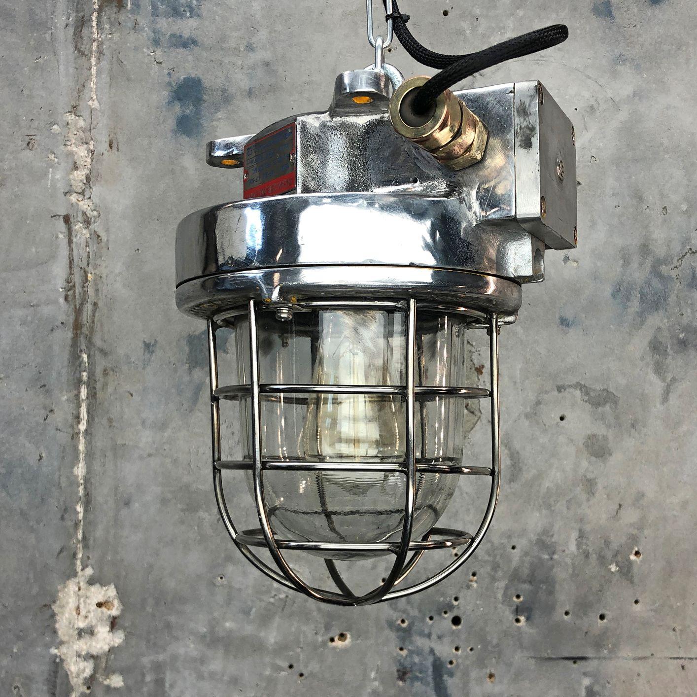 A late century Korean Industrial cast aluminum ceiling pendant with explosion proof glass dome and cage by Kukdong Elecom. It is rated IP66 which means this can be used outside or in wet zones. 

Professionally restored by hand in the UK by