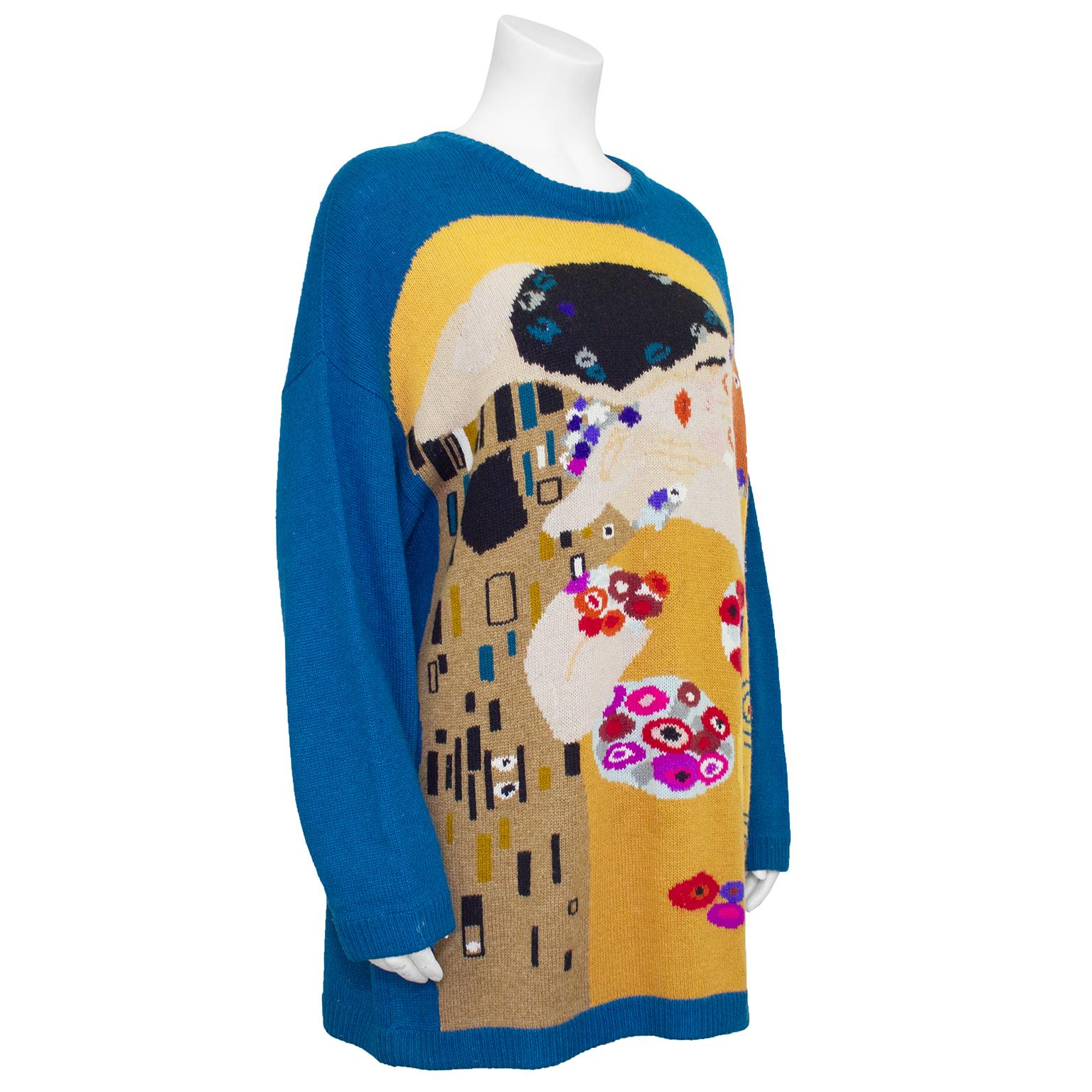 Unique 1980s Krizia knit sweater. Teal blue with large multi colour turn-of-the-century Gustav Klimt inspired illustration on front. Ribbed neckline, cuffs and hem. Slight dolman sleeve. Very visual. 15% wool, 15% cashmere, 15% Angora & 3% nylon.