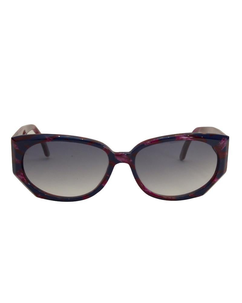 Vintage Krizia sunglasses from the 1980's. The frame of the sunglasses is a burgundy and navy blue marble on the outside and a burgundy and white marble on the inside. Frames have a classic shape, but the sharp diagonal outside bottom corners give