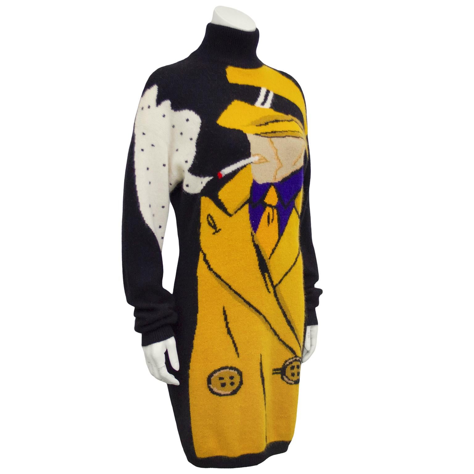 1980s Iconic Krizia wool, angora and nylon blend turtleneck sweater dress. Black with large yellow and blue pop art illustration of Dick Tracy smoking. Cigarette with pop of red at end of cigarette and cloud of white and black polka dot smoke. Long