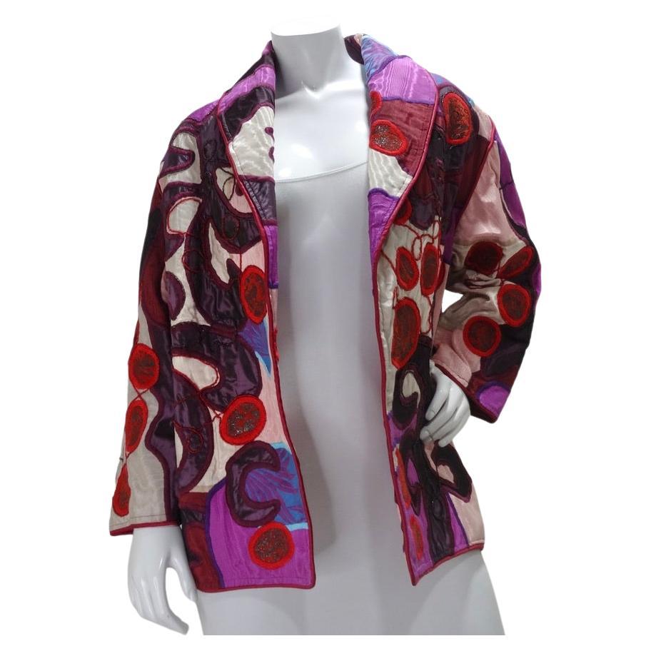 Your search for your next favorite jacket ends here! La Coleccion Judith Roberts circa 1980s has you covered. A plethora of vintage luxury fabrics and embroidery come together to create the most beautiful abstract design. Vibrant reds, pinks,
