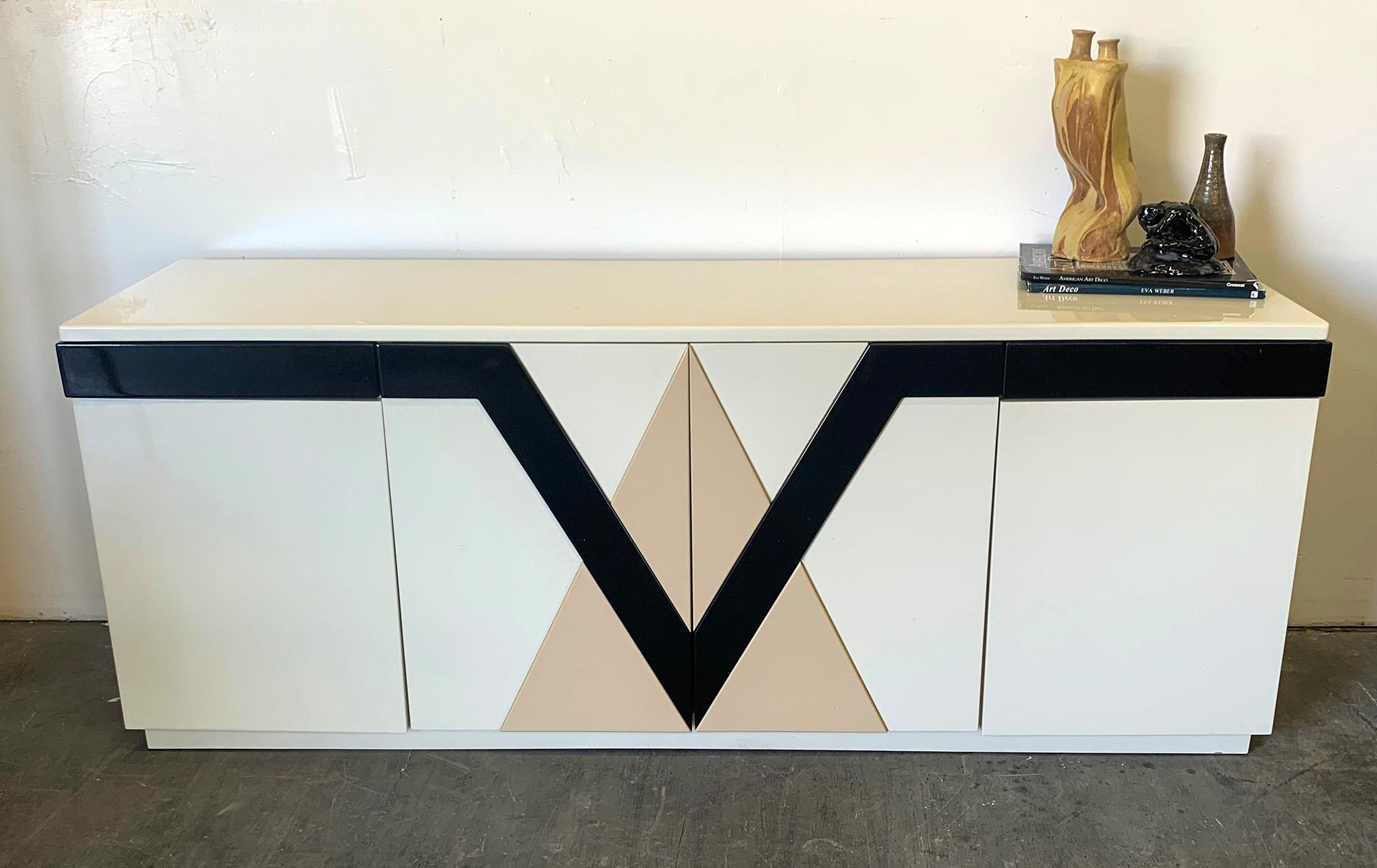 This credenza is simply stunning! A 1980s lacquered geometric credenza that just screams Kelly Wearstler style. The credenza features, doors and drawers and looks very Italian modern in style.

This credenza would pair very nicely with Karl