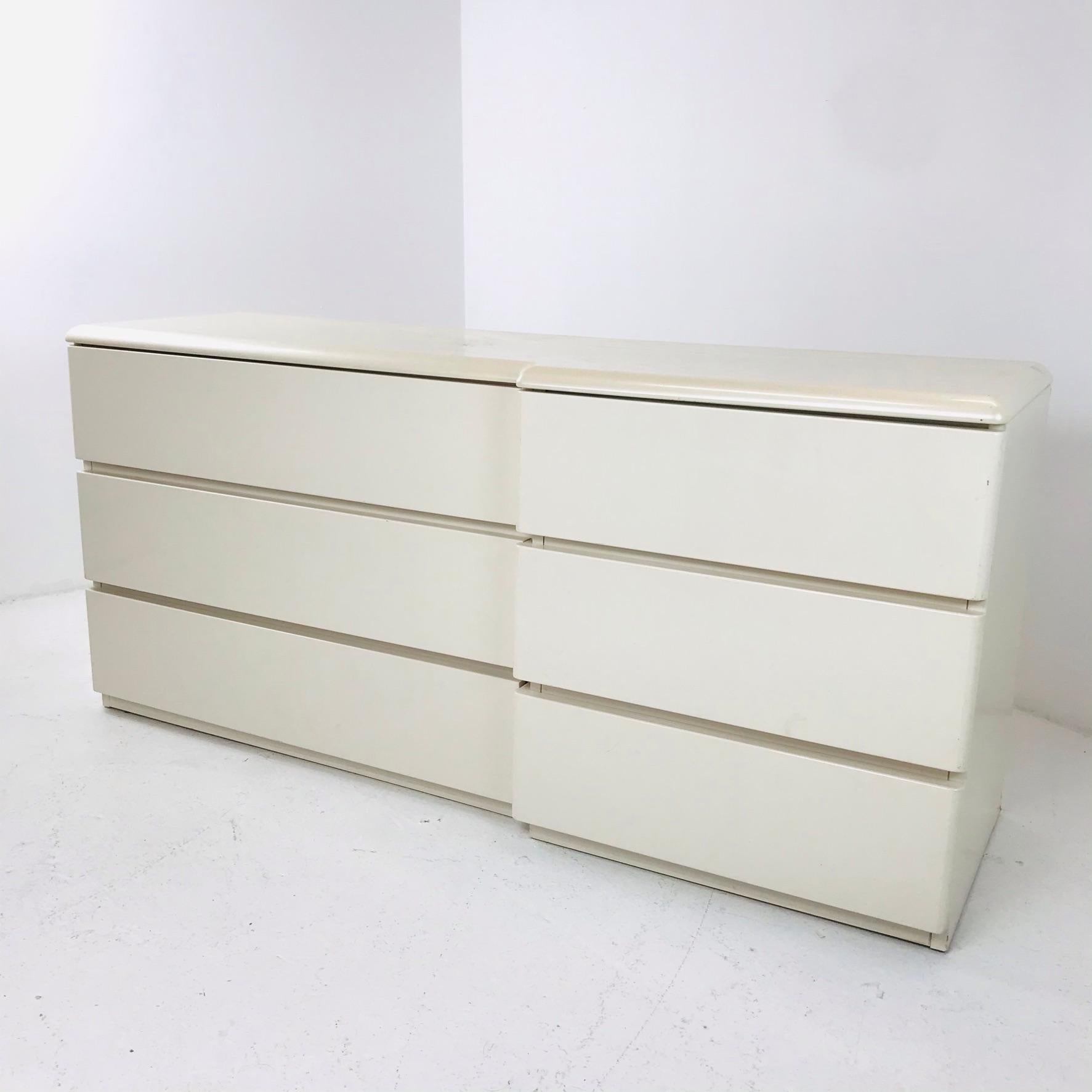 Original 1980s asymmetrical dresser by Lane. Creamy pearl finish, heavyweight, solid wood piece.