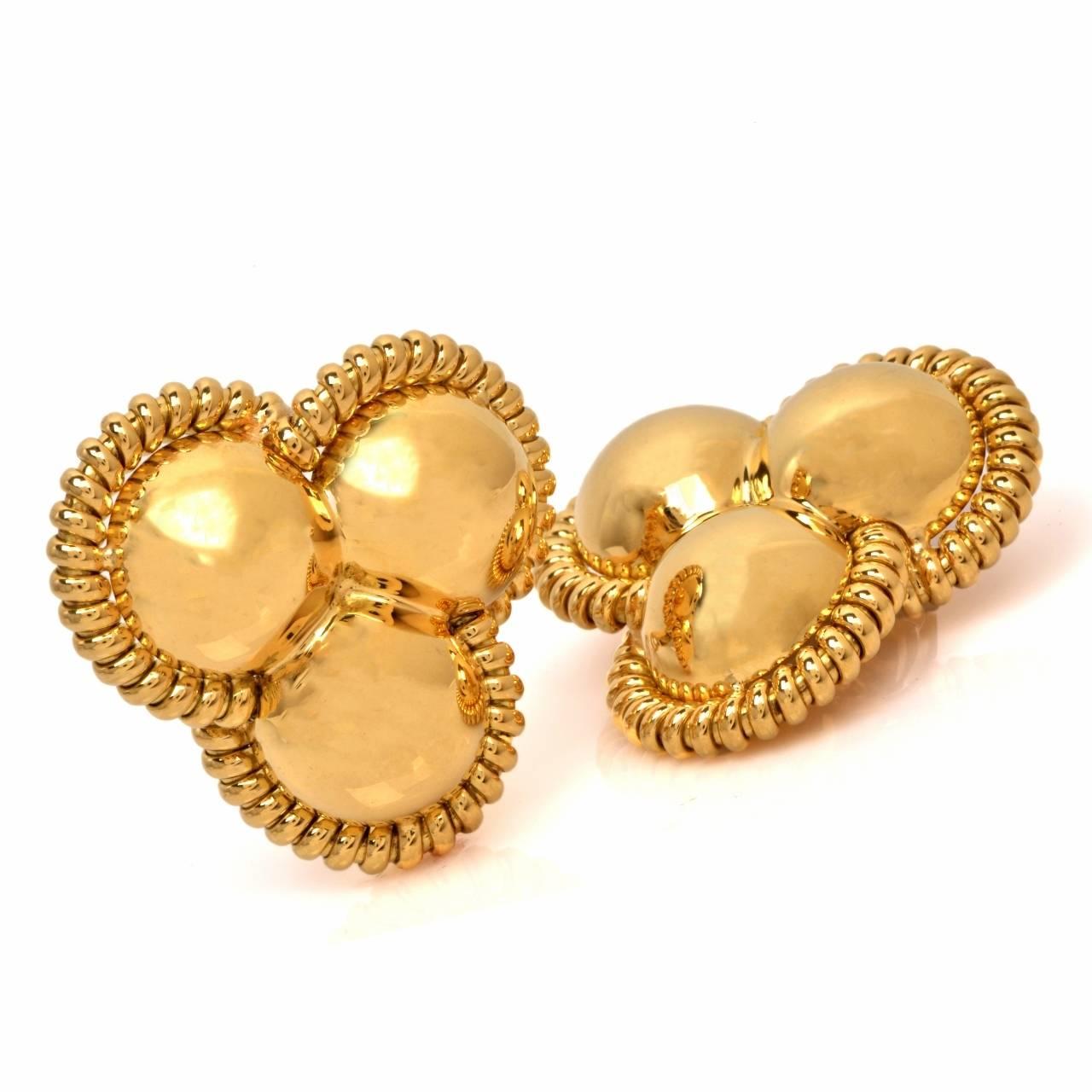 These Charming and elegant Italian earrings of bold and opulent aesthetic are crafted in solid 18K yellow gold, weigh 41.7 grams and measure 40 mm x 40 mm. These highly ornate high polish earrings incorporate each an assemblage of three overlapping