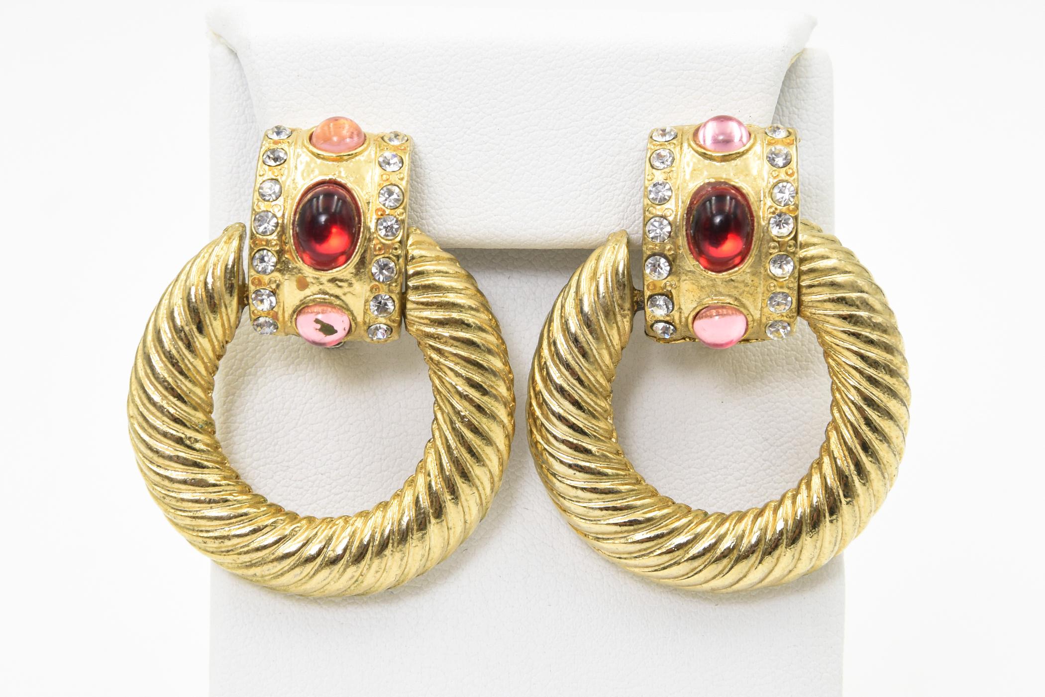 Givenchy style 1980s door knocker clip on earrings made of gold plated metal with glass stones that resemble diamonds, rubies and pink tourmaline.  The Backs have a clip-on so no pierced ears needed.