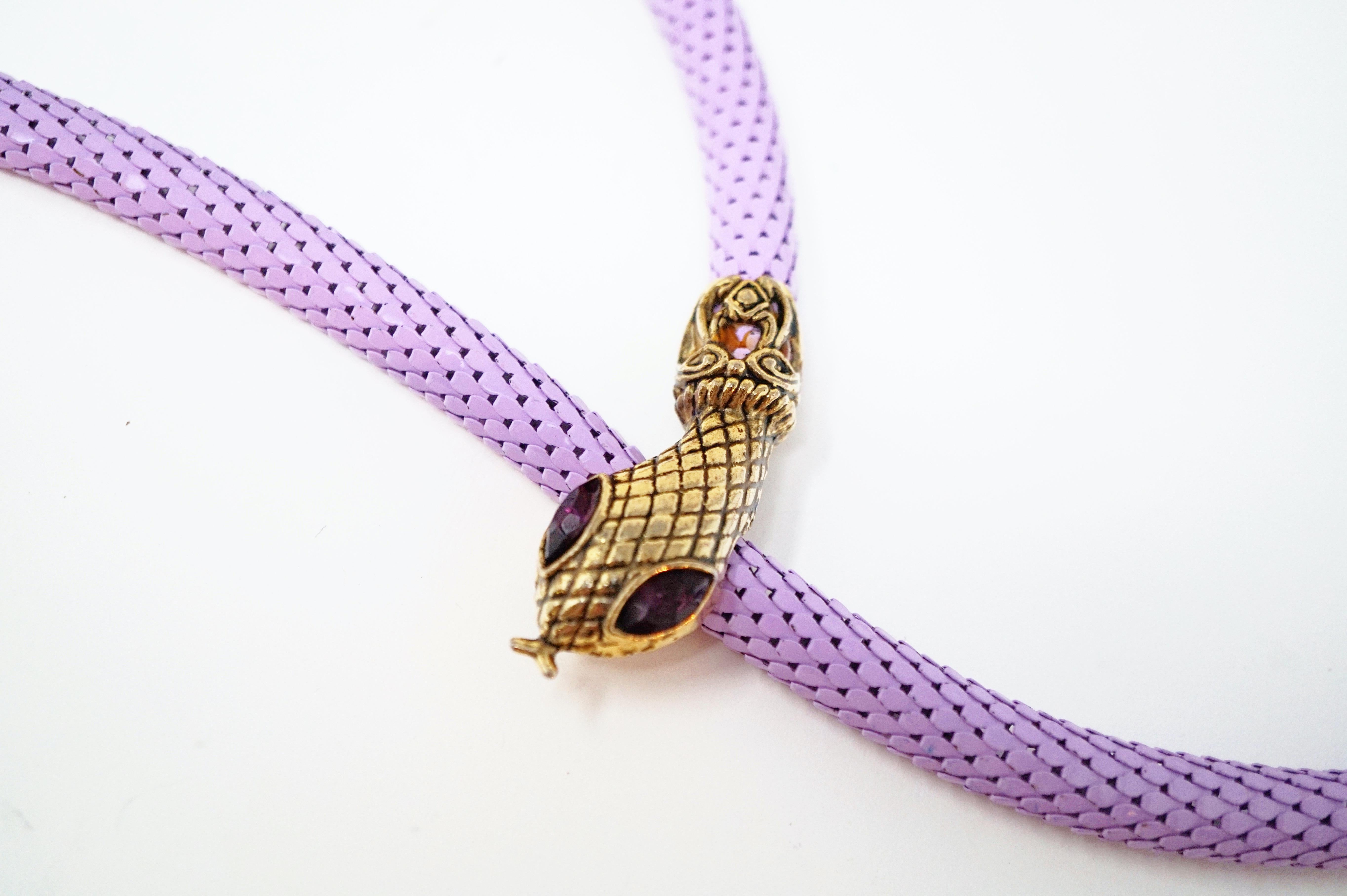 This unique vintage belt, which can also be worn as a necklace, combines lavender purple powder-coated mesh with gold tone snake head and tail embellishments. The golden snake head has Amethyst-colored crystal rhinestone eyes and hides a belt clip