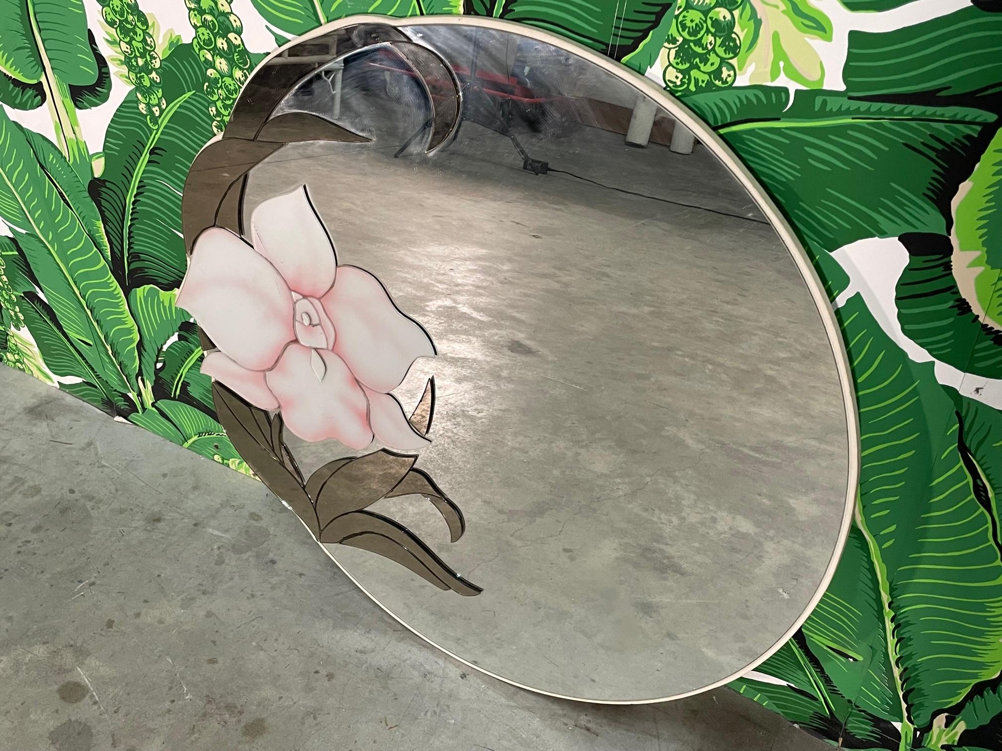 80s wall mirror by David Marshall features a flower motif done in layered glass pieces of both painted and smoked mirror. Good condition with minor imperfections consistent with age. May exhibit scuffs, marks, or wear, see photos for details.
  
 
