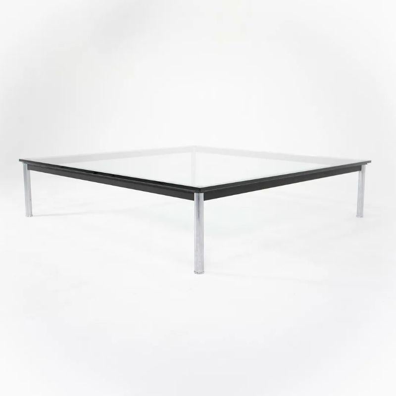 This is a 55 inch square LC10-P Coffee table designed by Le Corbusier, Pierre Jeanneret, and Charlotte Perriand, produced by Cassina in Italy. The table was produced circa 1980s and is in very good to excellent vintage condition. The chromed and