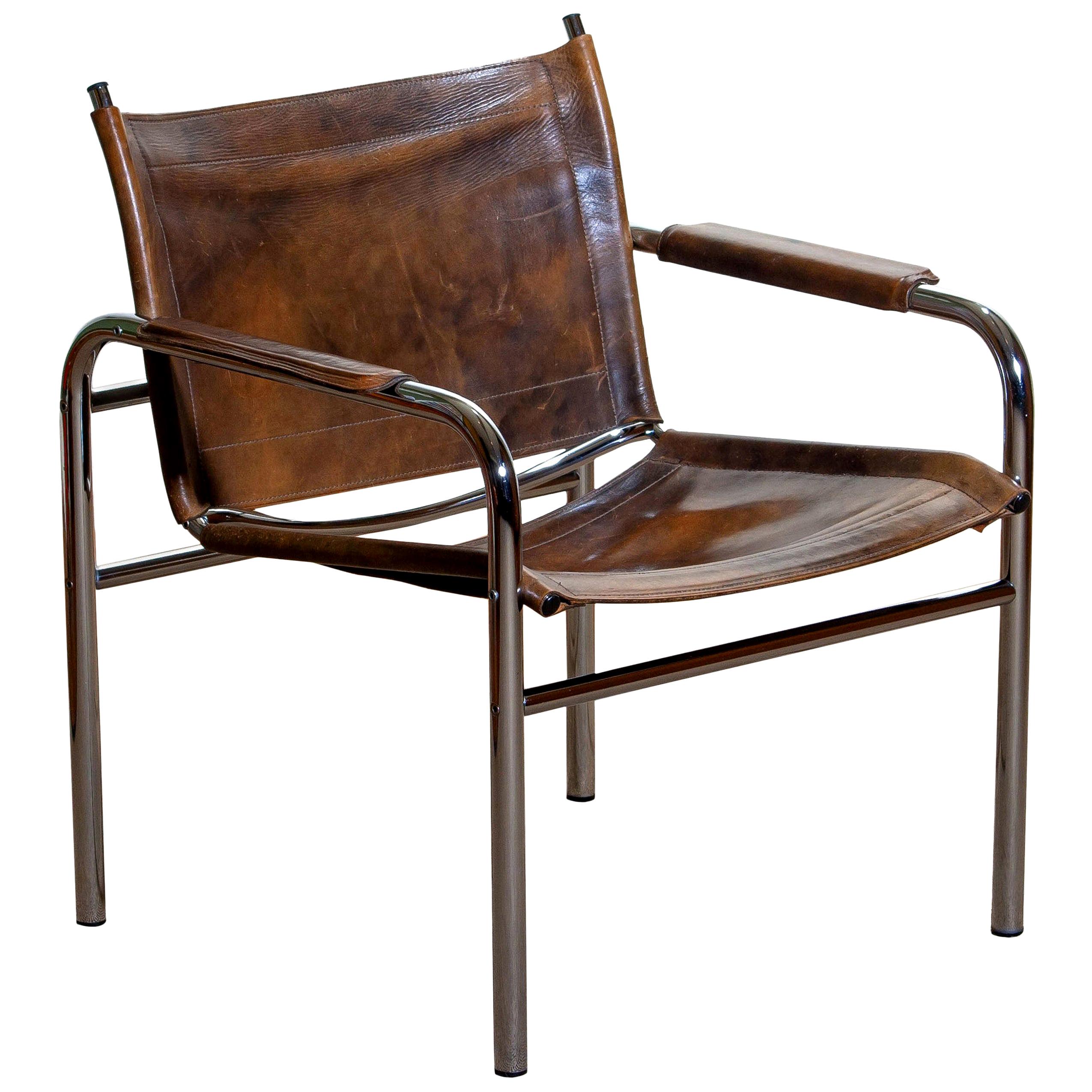Beautiful armchair, model Klinte, designed by Tord Bjorklund, Sweden. The chair has a tubular chromed steel frame with brown-taupe leather back / seating and armrests with a beautiful patina.
Period: 1980.

    
 